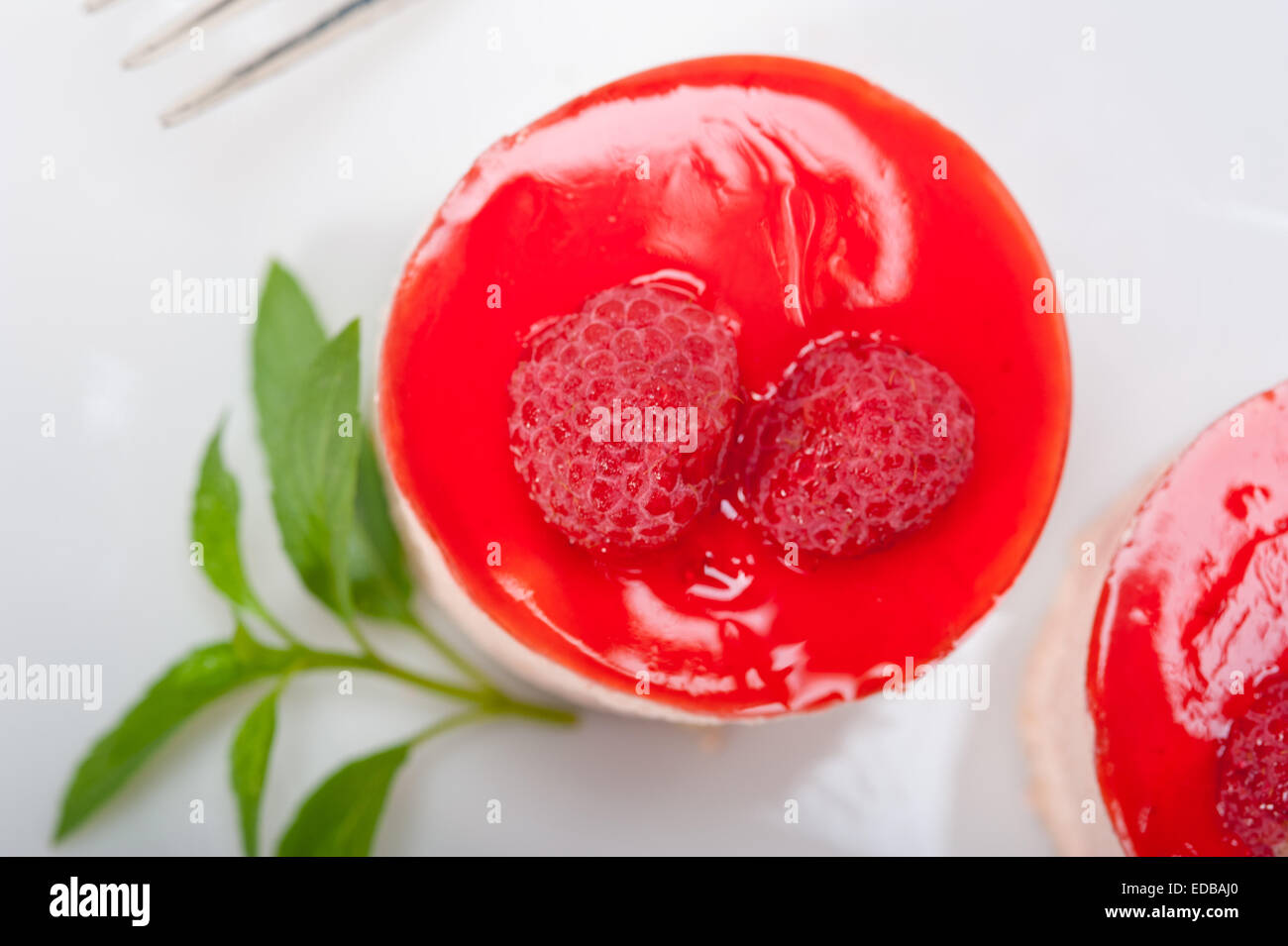 fresh raspberry cake mousse dessert round shape with mint leaves Stock ...