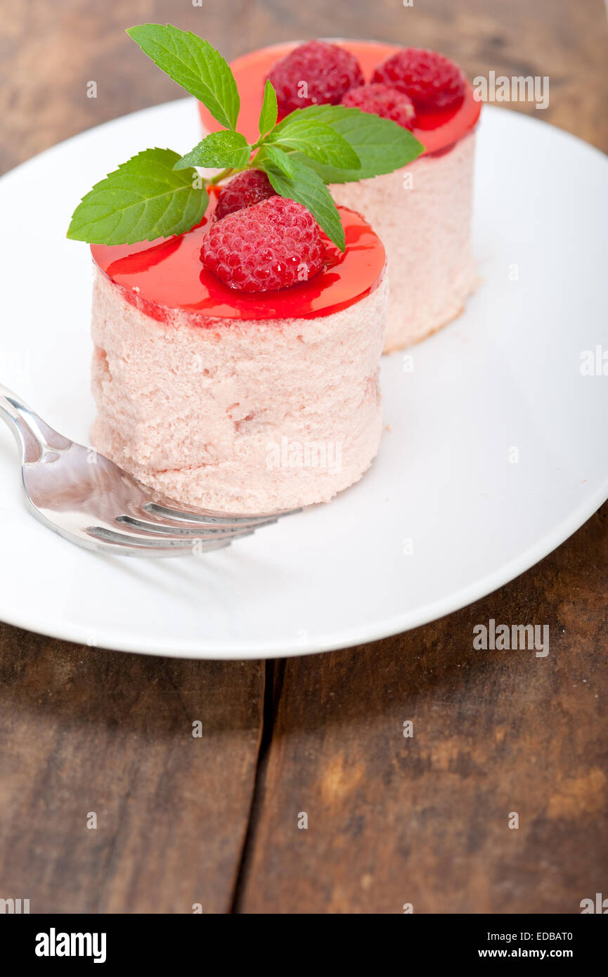 fresh raspberry cake mousse dessert round shape with mint leaves Stock ...