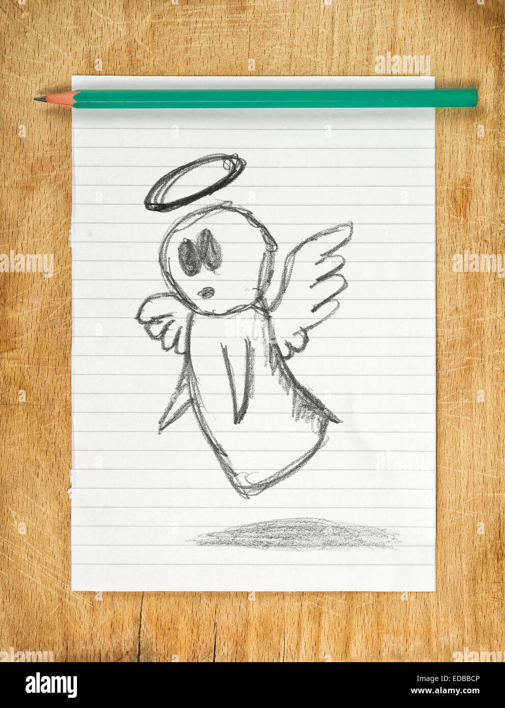 Doodle drawing of angel on white paper with pencil, moralizer concept. Stock Photo
