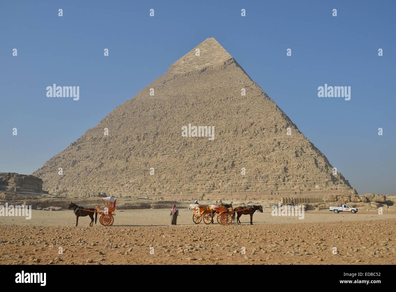 Empty carriages for tourists in front of the Pyramid of Chephren, Giza, Egypt Stock Photo