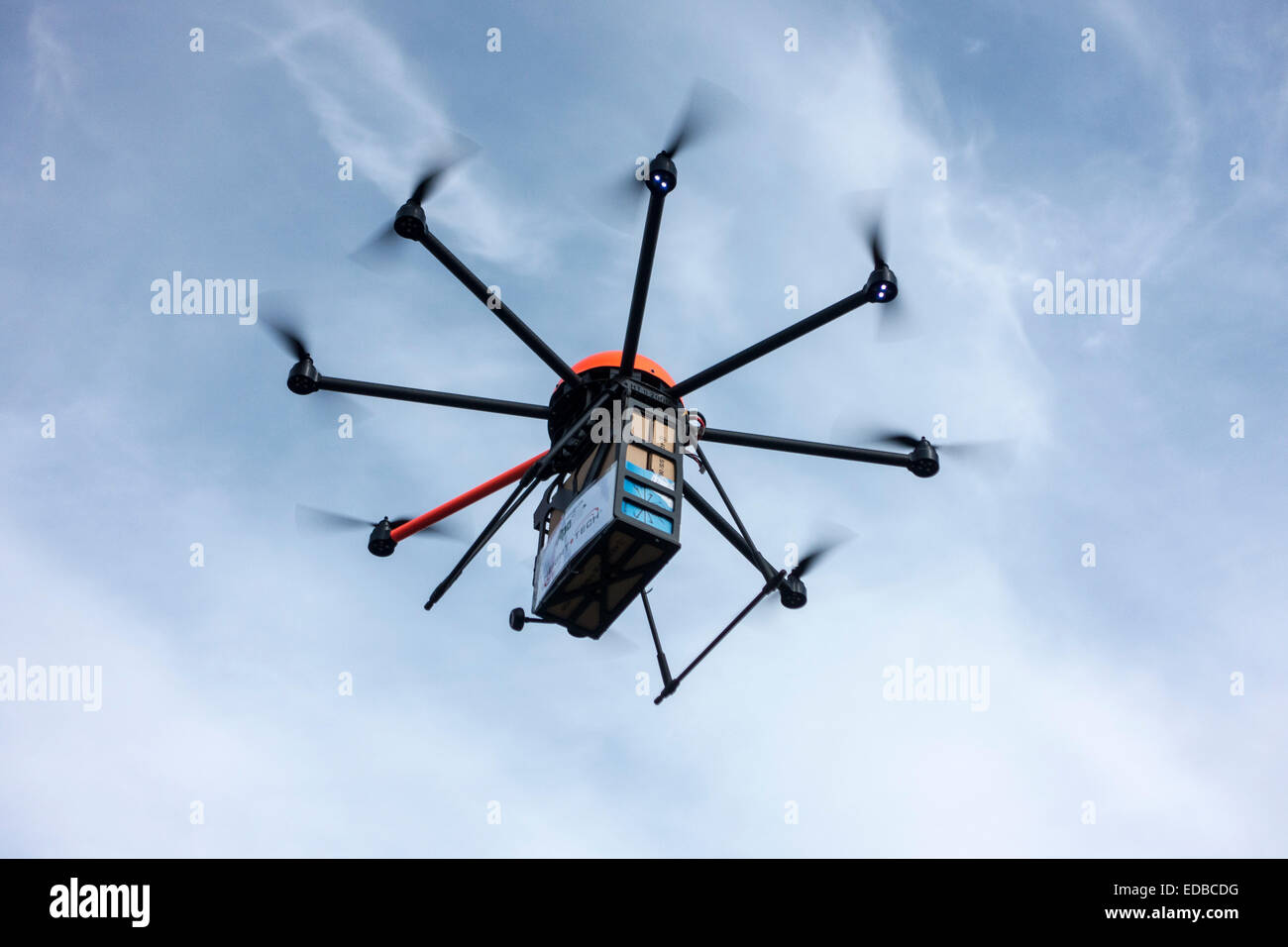 A drone carrying a package, Germany Stock Photo