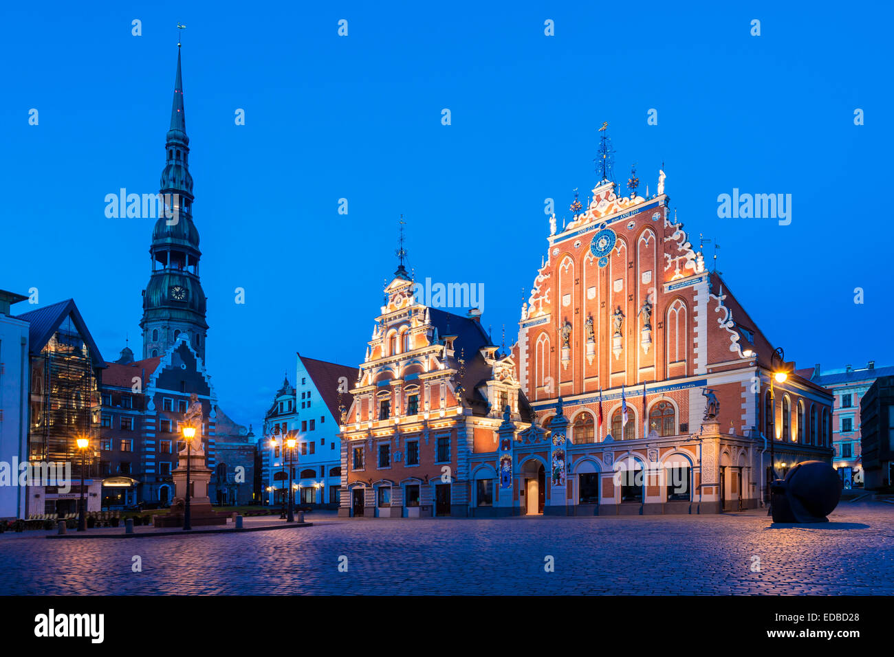 House of the Blackheads with St. Peter's Church in Town Hall Square, historic centre, blue hour, dusk Stock Photo