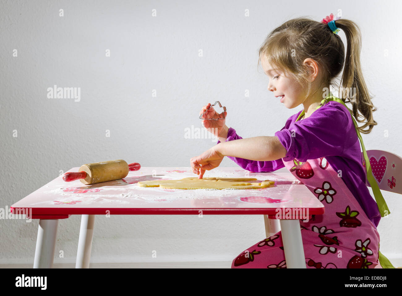 Girl, 3 years, baking Christmas cookies Stock Photo