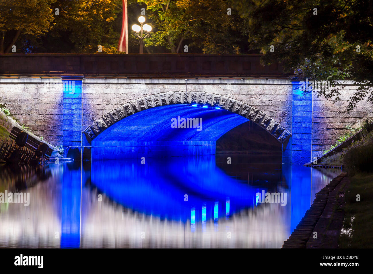 Illuminated bridge along the Pilsetas Canal, Riga, Latvia Stock Photo