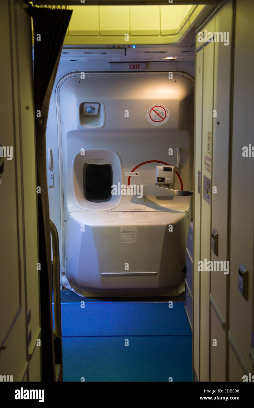 Closed aircraft door of a widebody aircraft during flight Stock Photo