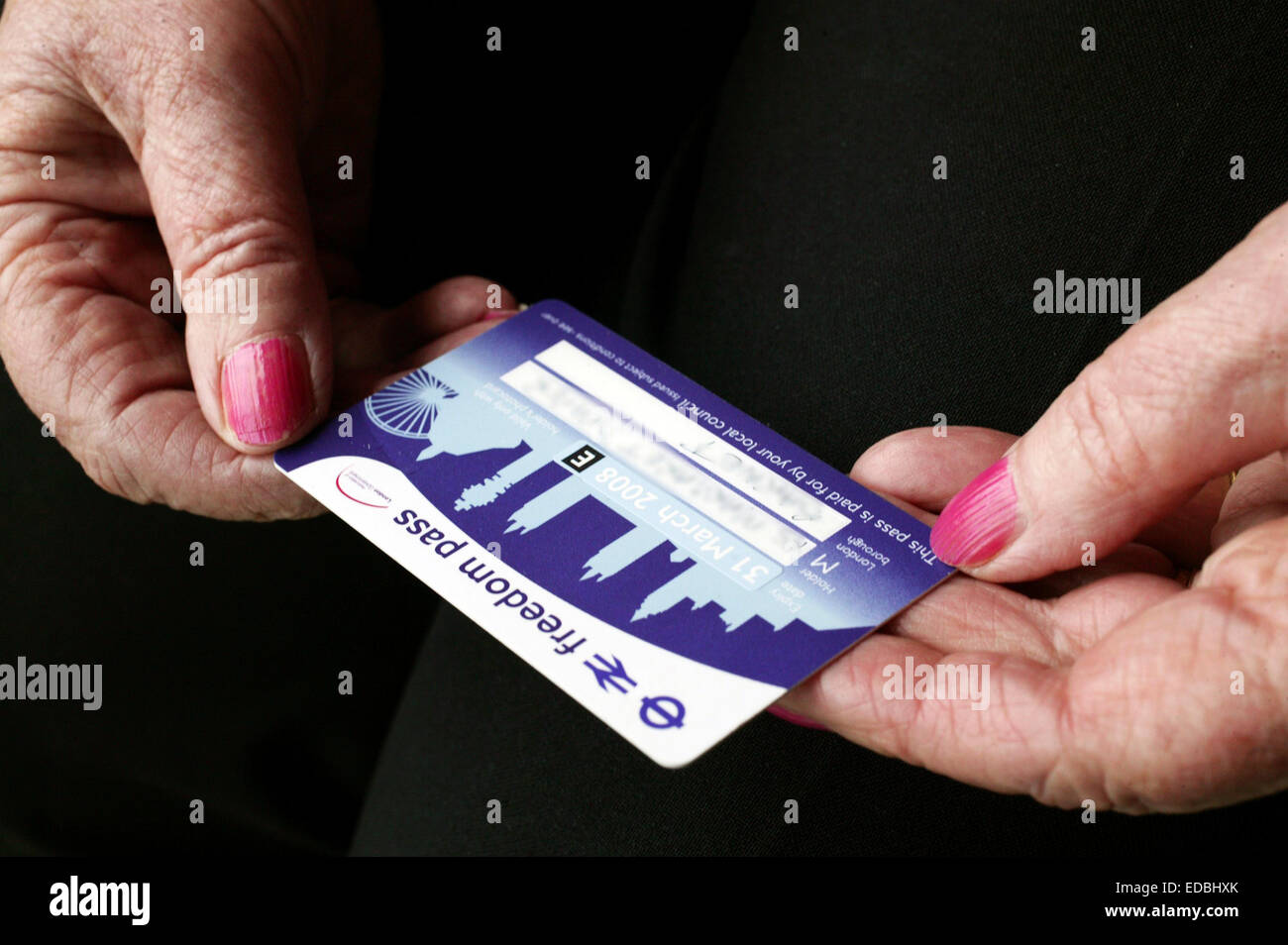 A-Day. Radical changes to how individuals can save for retirement come into force on Thursday, simplifying existing rules and introducing greater flexibility. Elderly person holding a Freedom Pass. Stock Photo