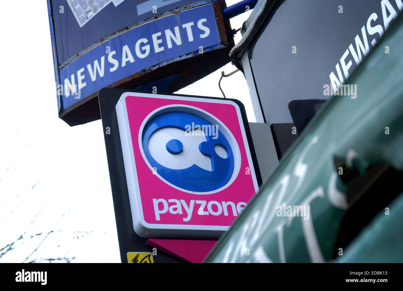 Exterior of a newsagents bearing the Payzone branding and payment facility. Stock Photo