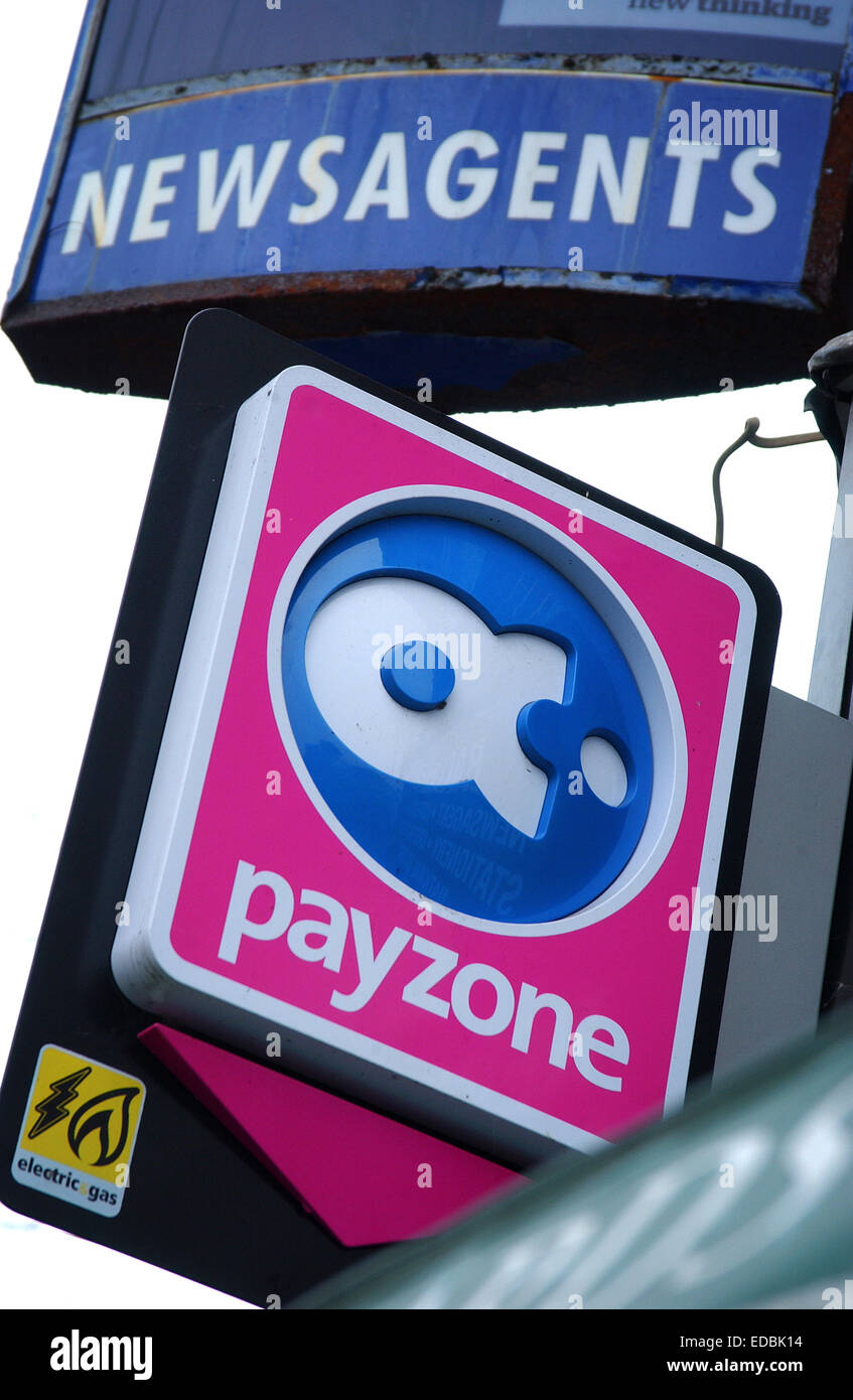 Exterior of a newsagents bearing the Payzone branding and payment facility. Stock Photo