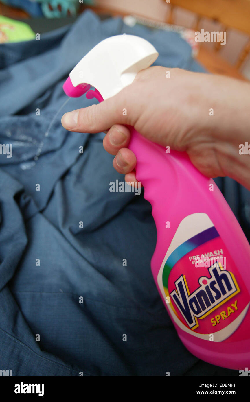 someone using Vanish Spray; a Reckitt Benckiser brand Stock Photo - Alamy