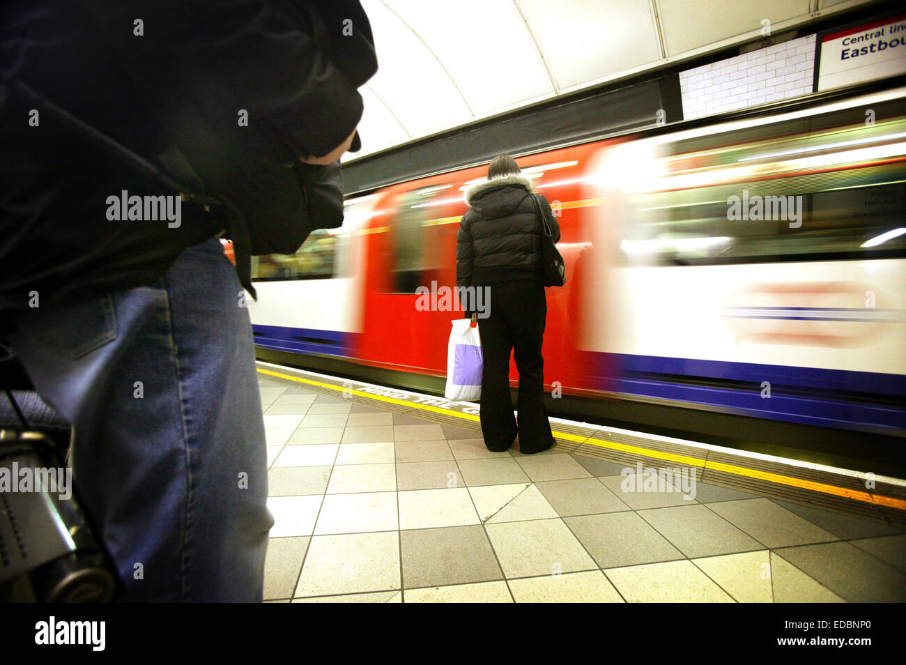London, UK, 7th January 2005. A passenger waiting to board a London Underground train. Stock Photo