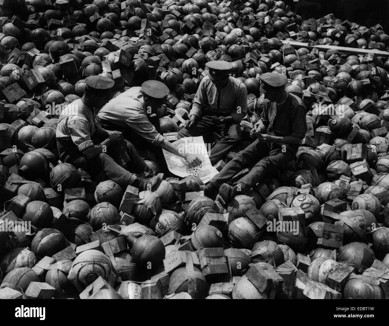 Fusing stoke mortar shells and playing cards. Stock Photo