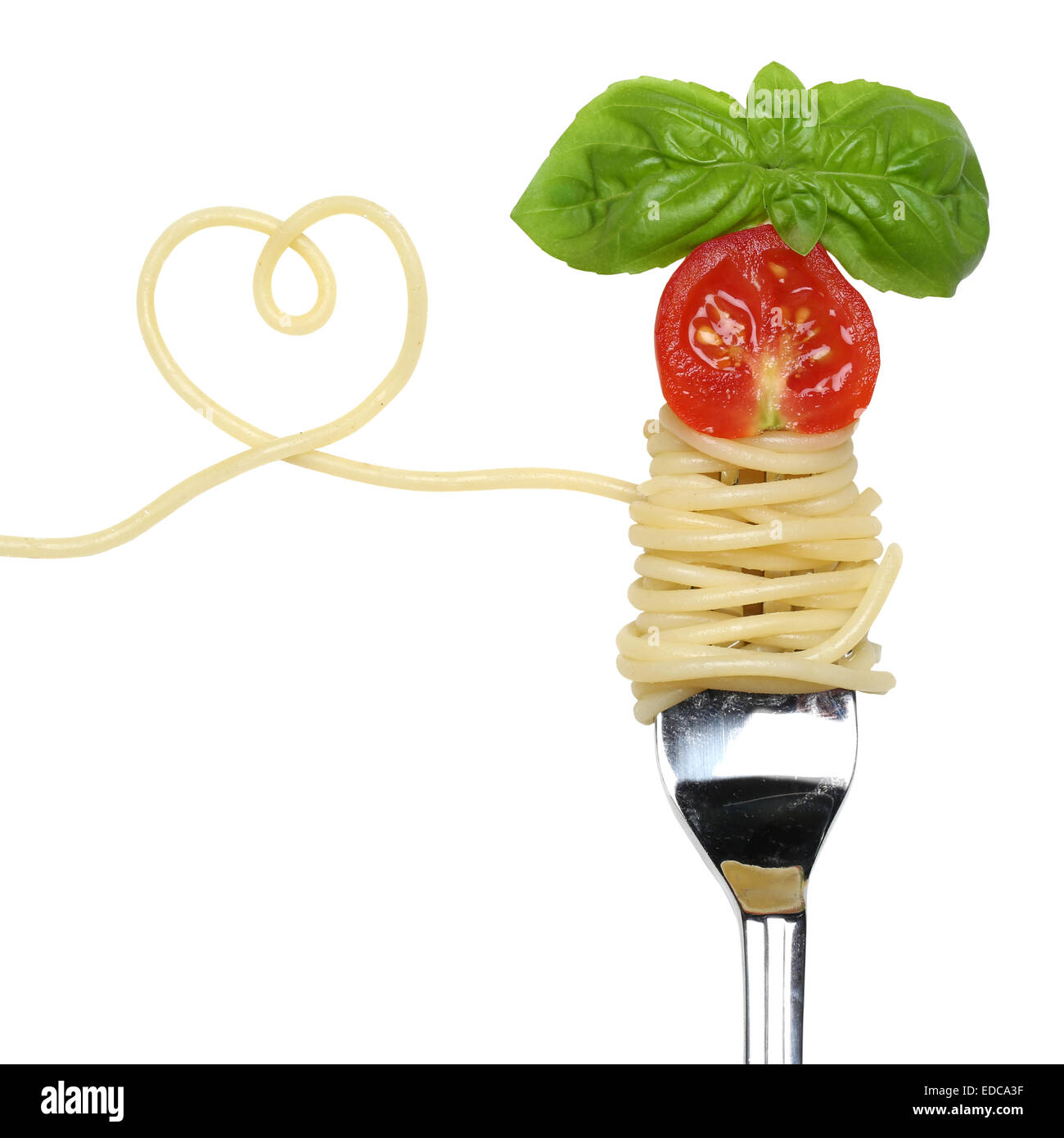 Spaghetti noodles pasta meal with heart, tomato on a fork love topic Stock Photo