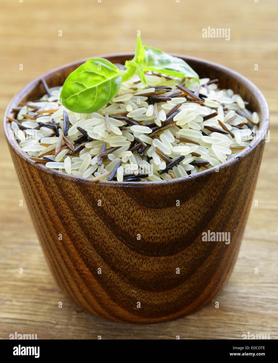 mix of wild black and white rice in a wooden bowl Stock Photo Alamy
