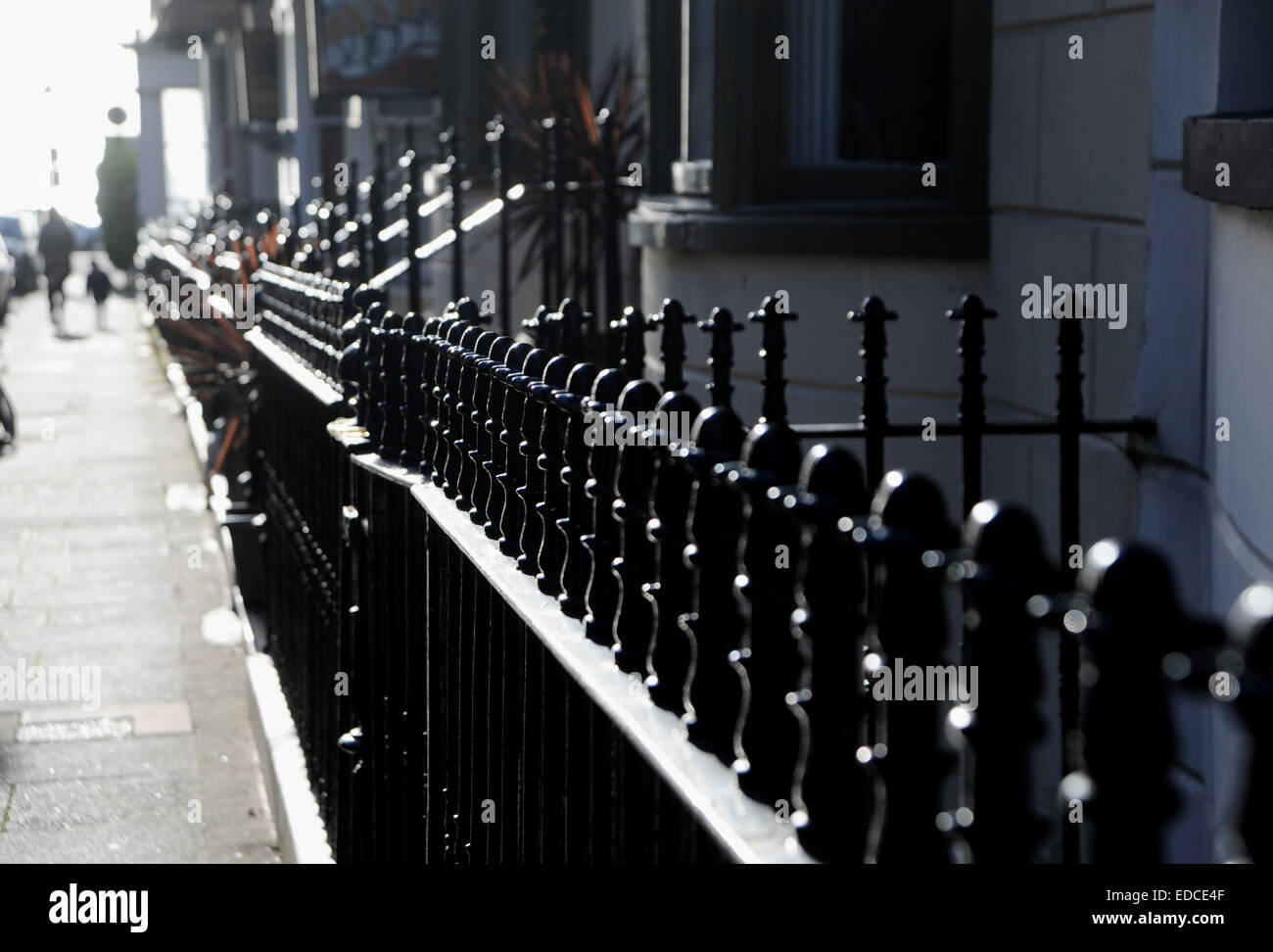 Typical black iron railings along streets of Brighton UK Stock Photo