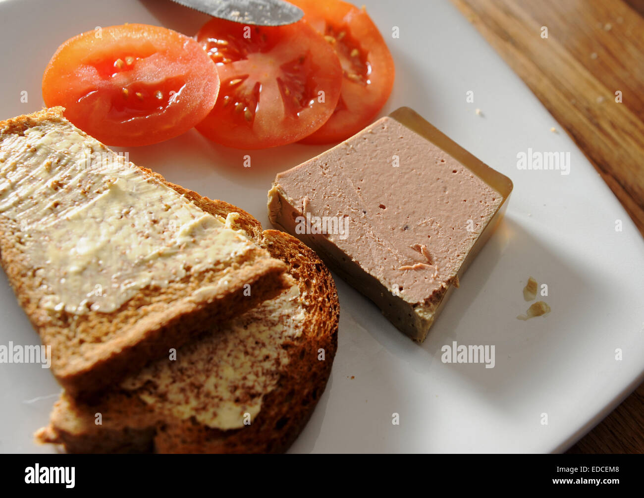 Smooth duck liver pate with sliced tomato and toast Stock Photo - Alamy