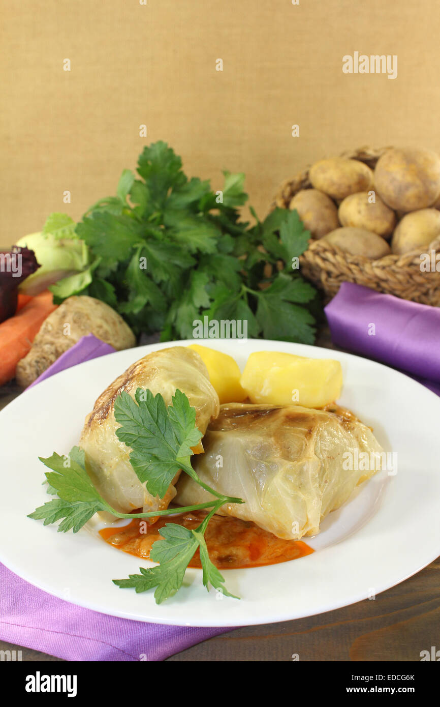 Cabbage roulade with potatoes and sauce on a napkin Stock Photo - Alamy