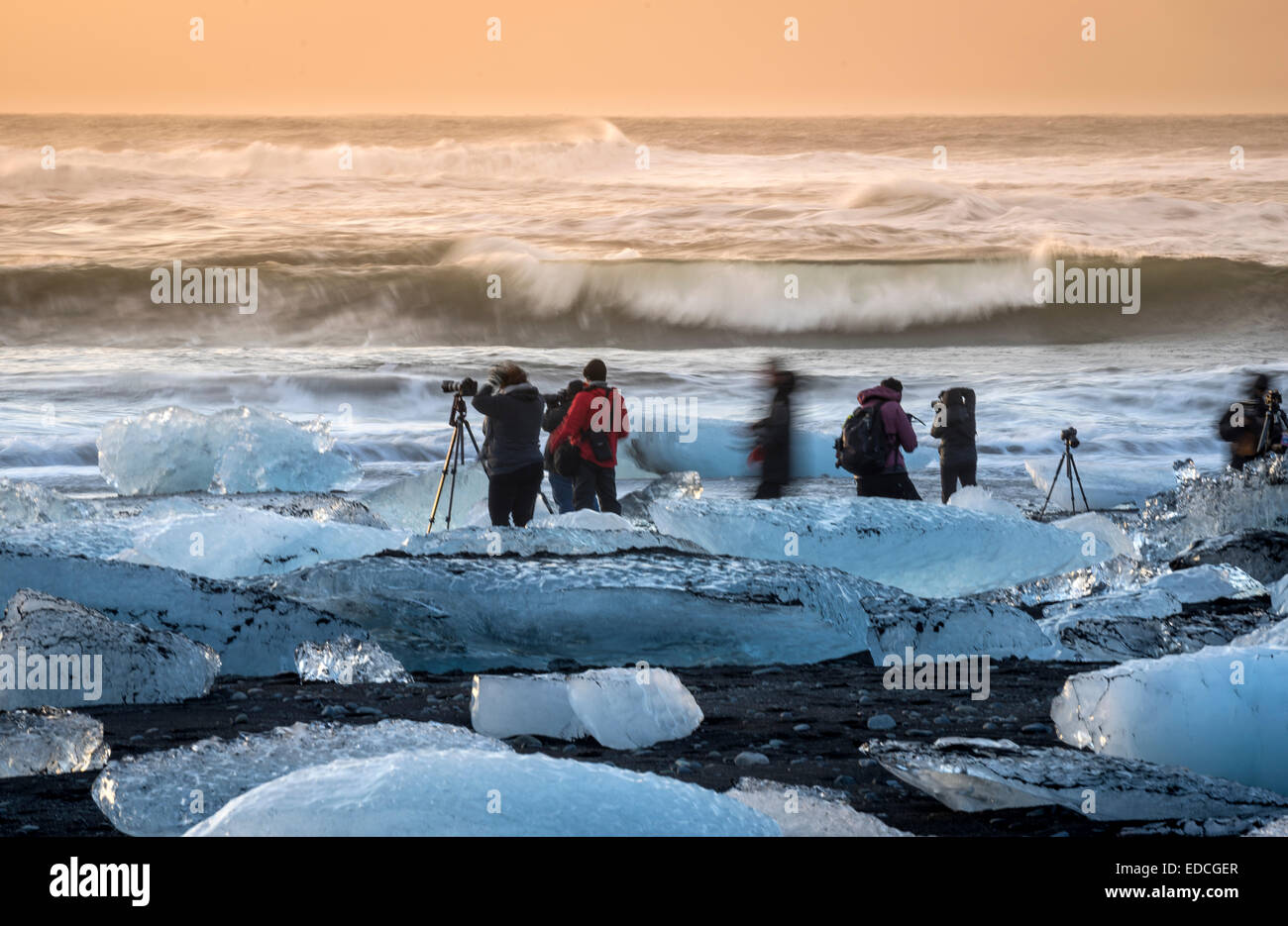 Photographers taking pictures at the Breidamerkurfjara beach, Vatnajokull Ice Cap, Iceland. Stock Photo