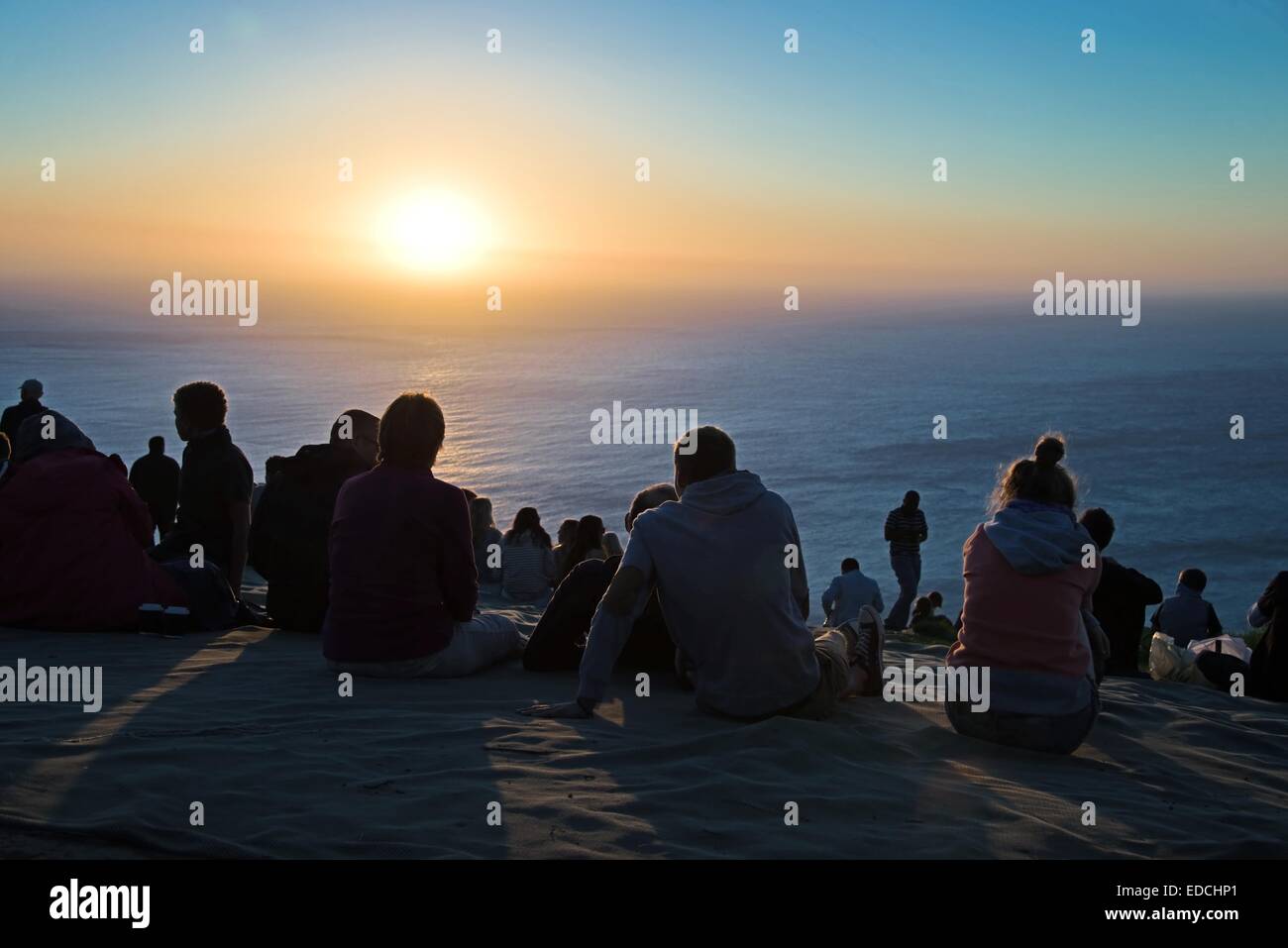 People enjoying the sunset at Signal Hill, a hill famous for its view on Cape Town city. Stock Photo
