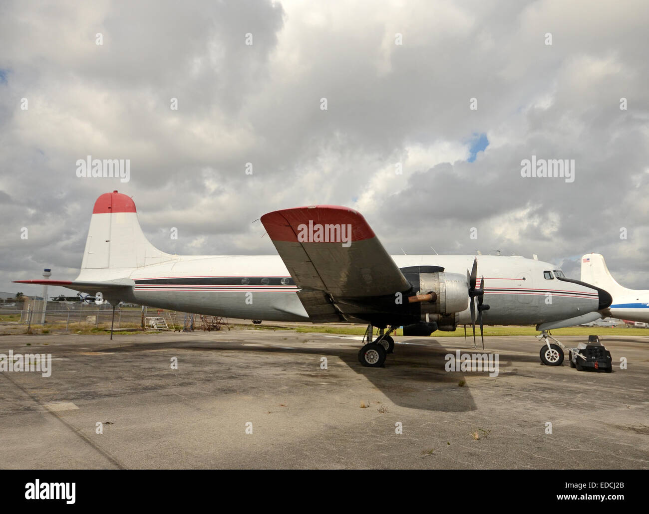 Retro propeller airplane on the ground side view Stock Photo