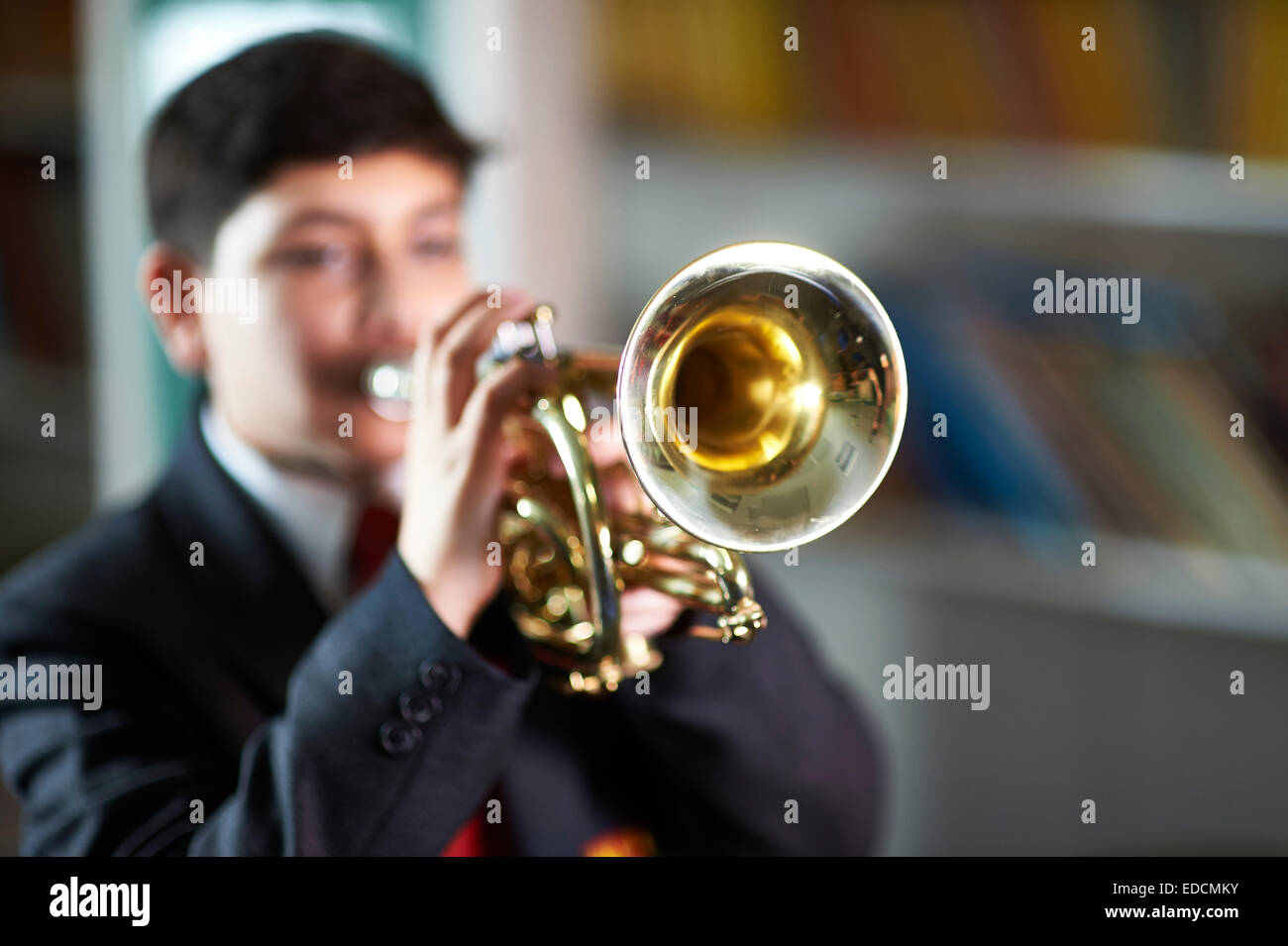 boy playing trumpet Stock Photo