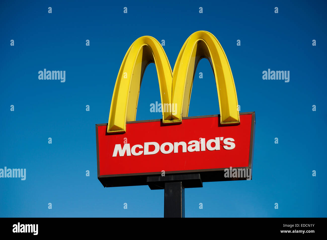 London, UK - December 13, 2014: McDonalds logo on blue sky background ...
