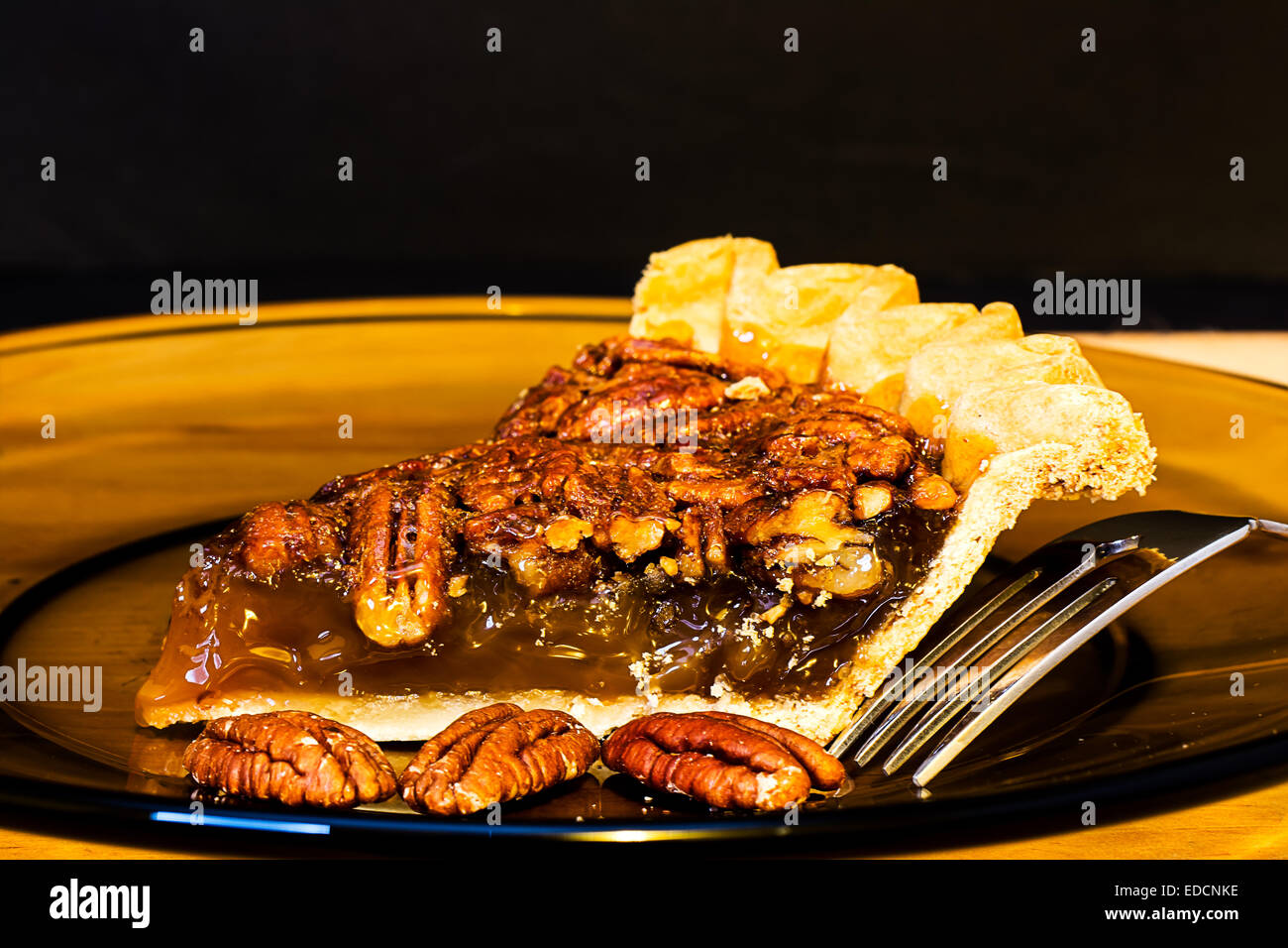 Pecan pie closeup with fork on plate. Stock Photo