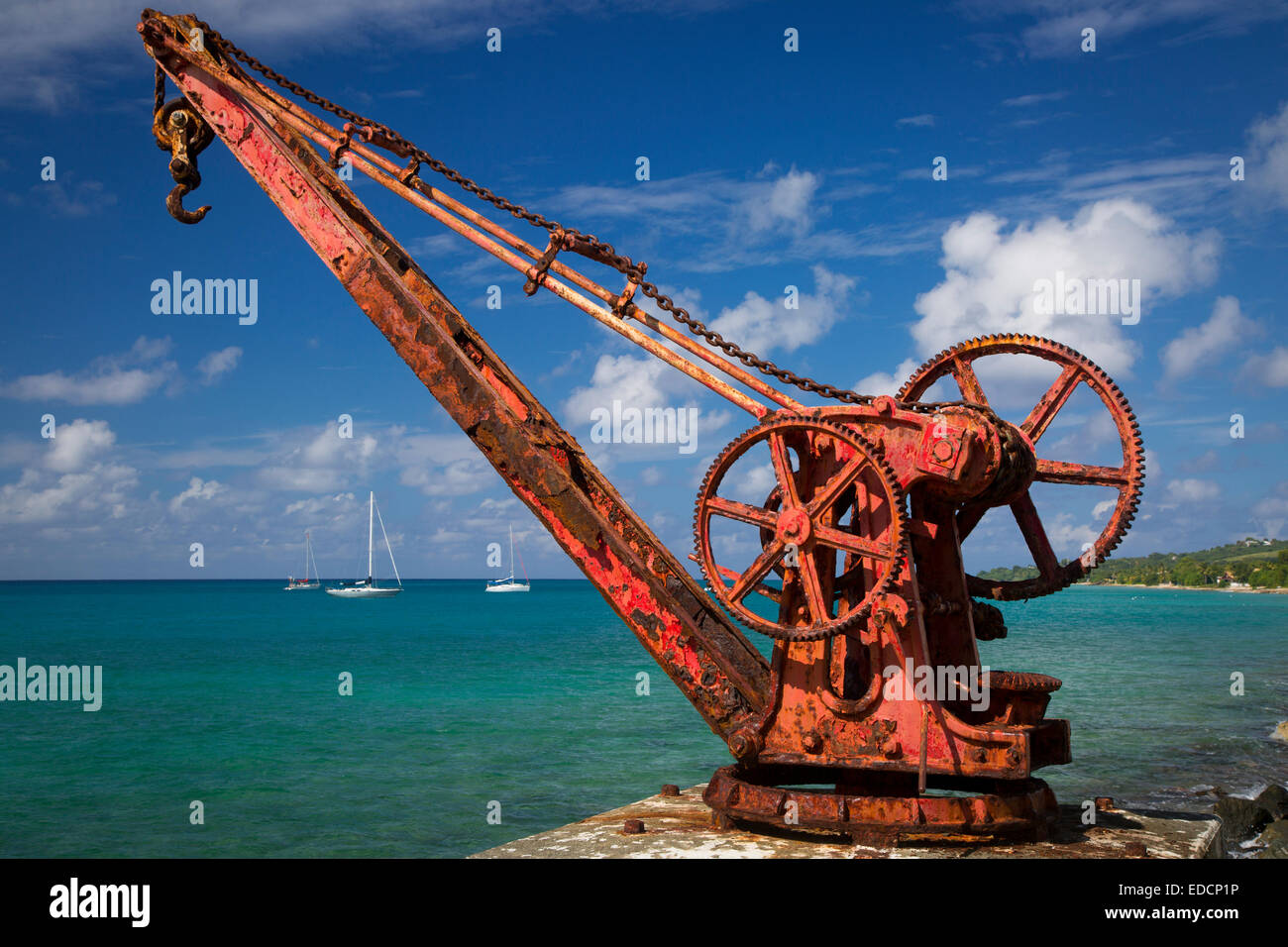 Rusted old boat crane along the shore at Frederiksted, St Croix, US Virgin Islands, West Indies Stock Photo