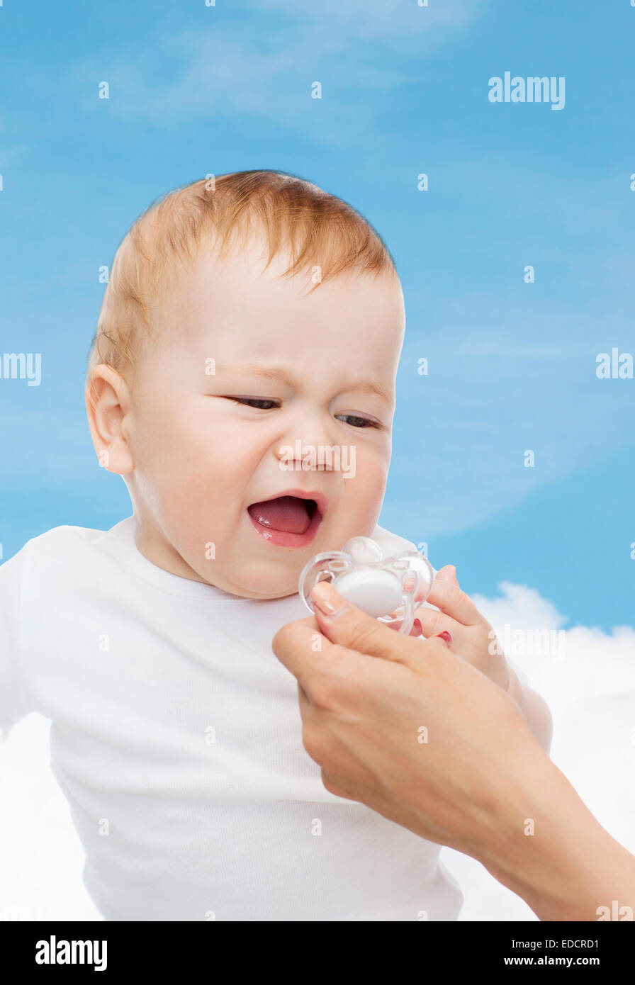 crying baby with dummy Stock Photo Alamy