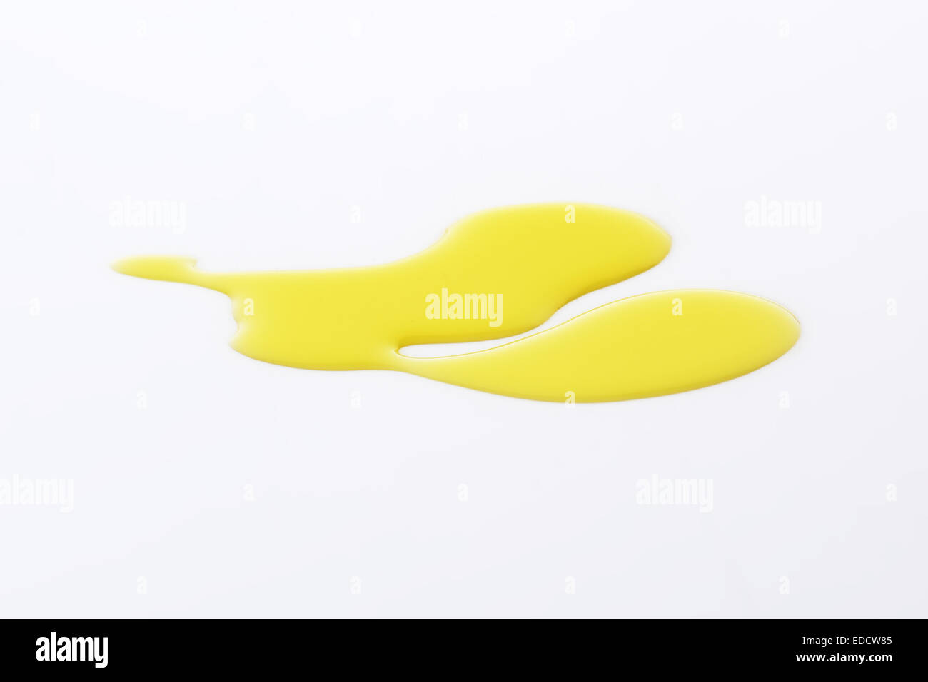 Olive oil spill on plain background Stock Photo Alamy
