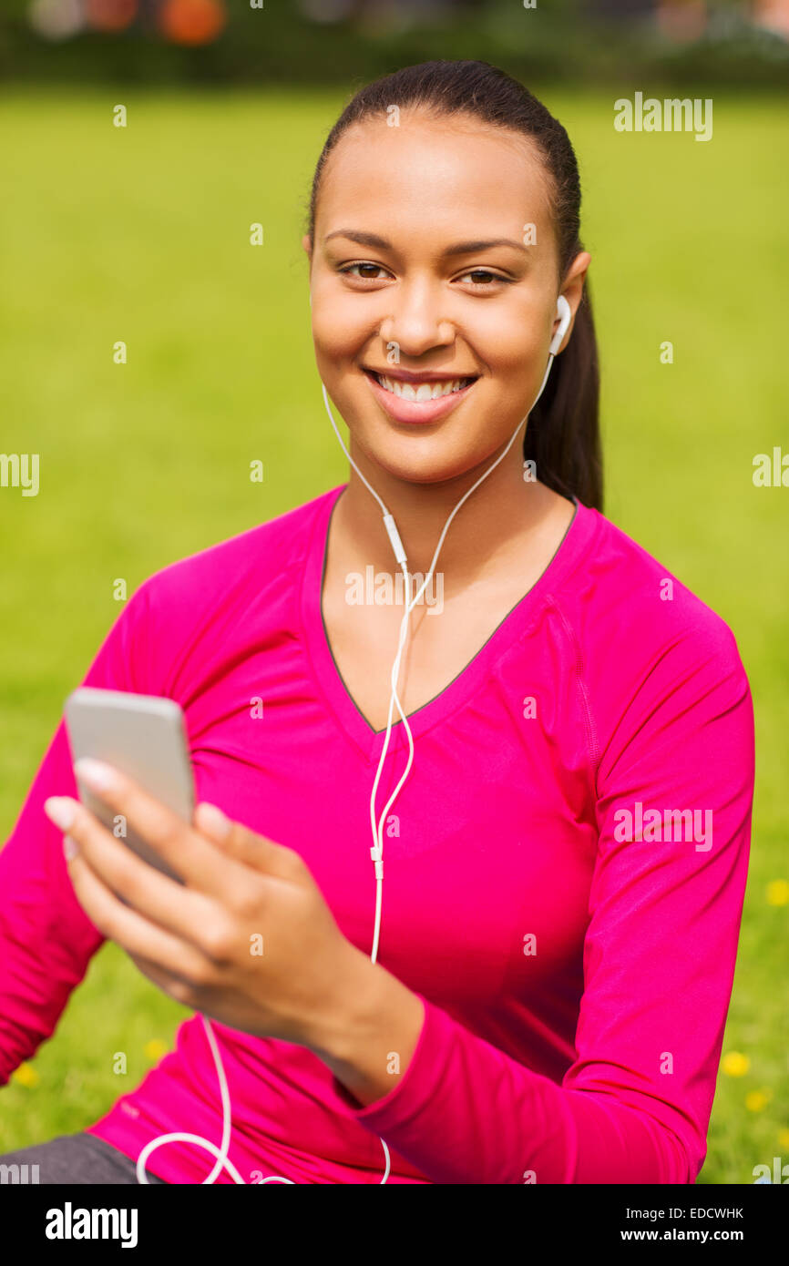 smiling african american woman with smartphone Stock Photo - Alamy