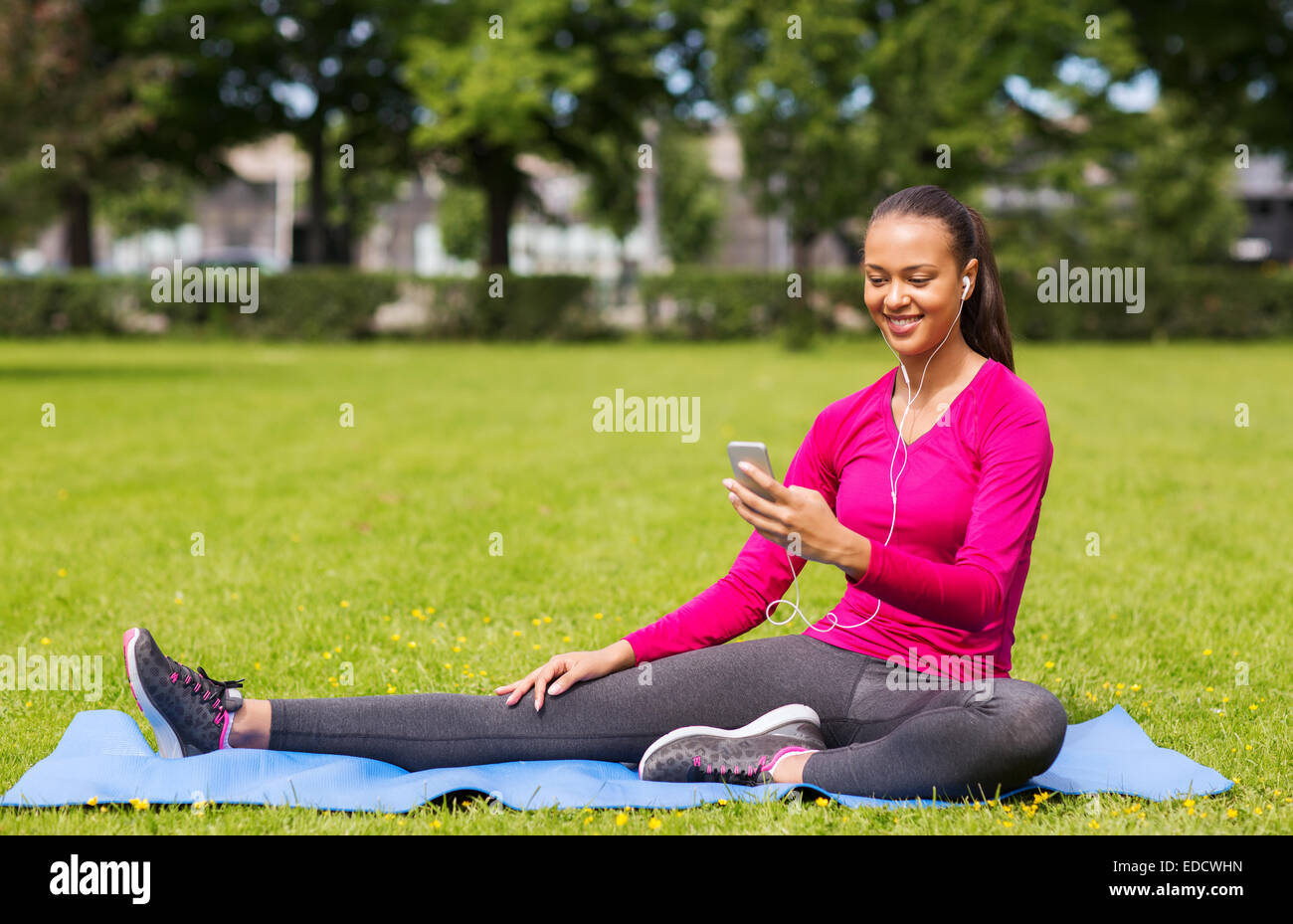 smiling african american woman with smartphone Stock Photo - Alamy