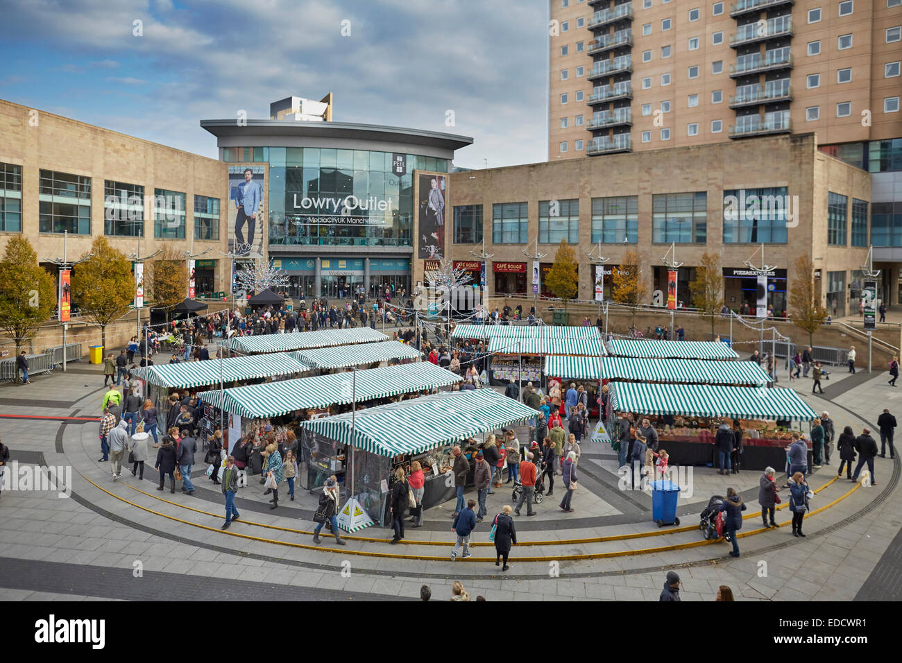 Salford Quays Lowry Outlet Mall  with a market outside Stock Photo
