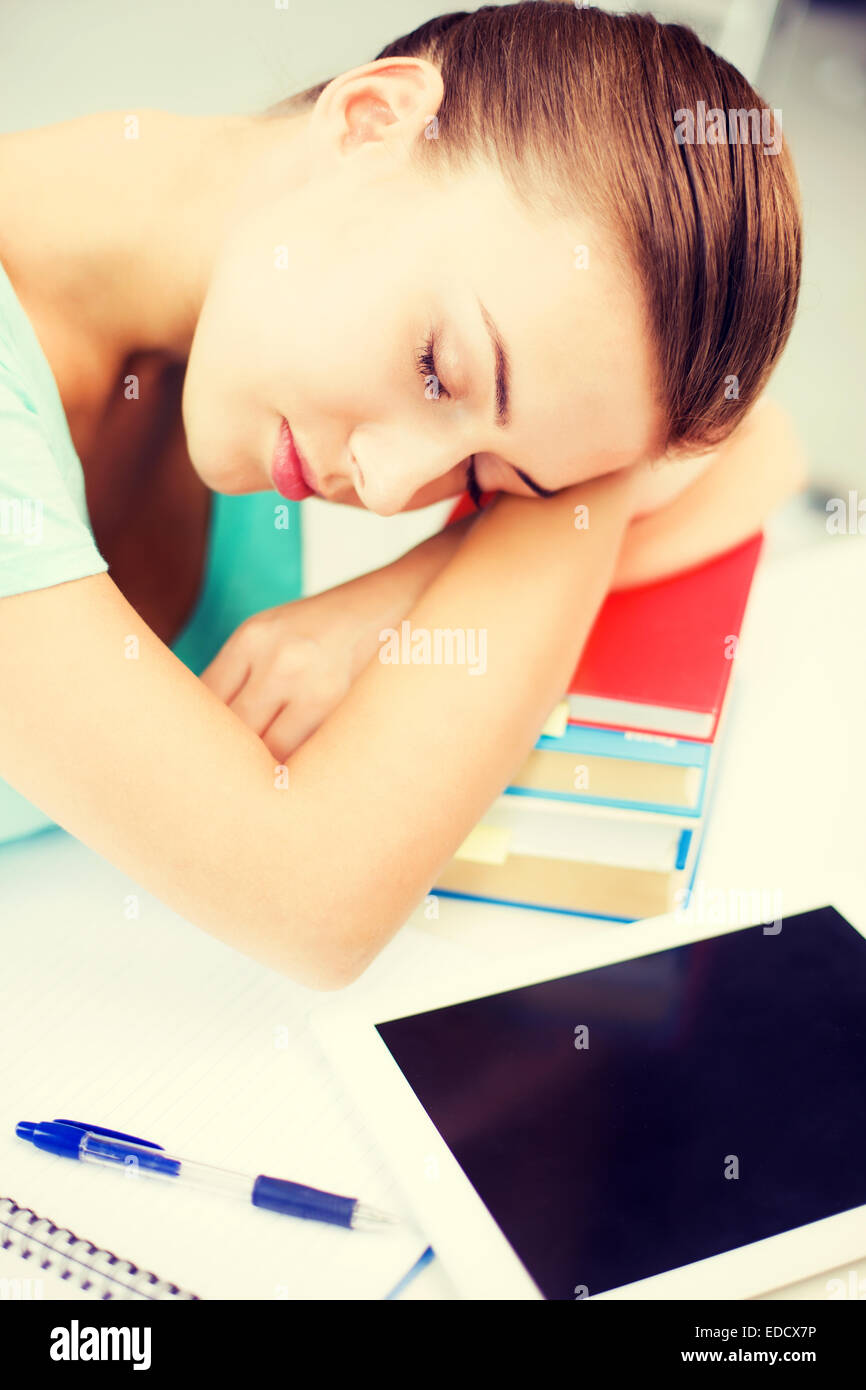 tired student sleeping on stock of books Stock Photo - Alamy