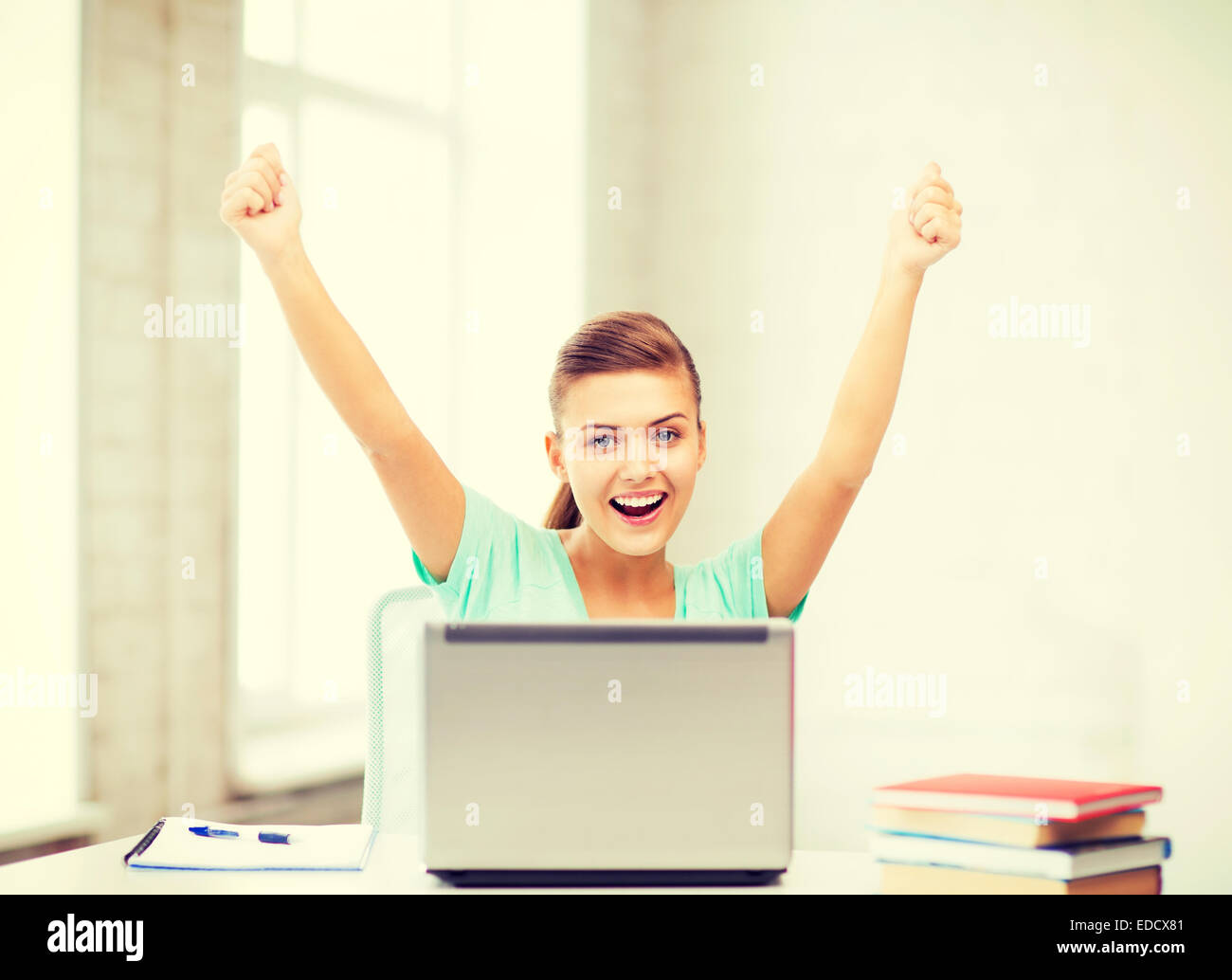 happy student girl with laptop at school Stock Photo - Alamy