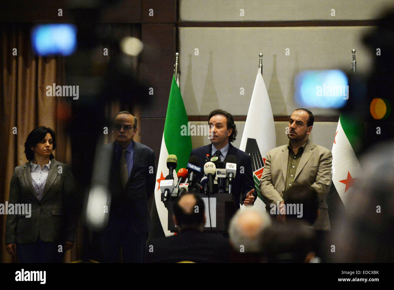 Istanbul, Turkey. 5th Jan, 2015. The newly elected president of Syria's main opposition National Coalition Khaled Khoja(2nd R) delivers a speech at the press conference in Istanbul, Turkey, on Jan. 5, 2015. The newly elected president of Syria's main opposition National Coalition on Monday ruled out the possibility of taking part in new talks proposed by Russia to end the Syrian conflict. Credit:  Lu Zhe/Xinhua/Alamy Live News Stock Photo