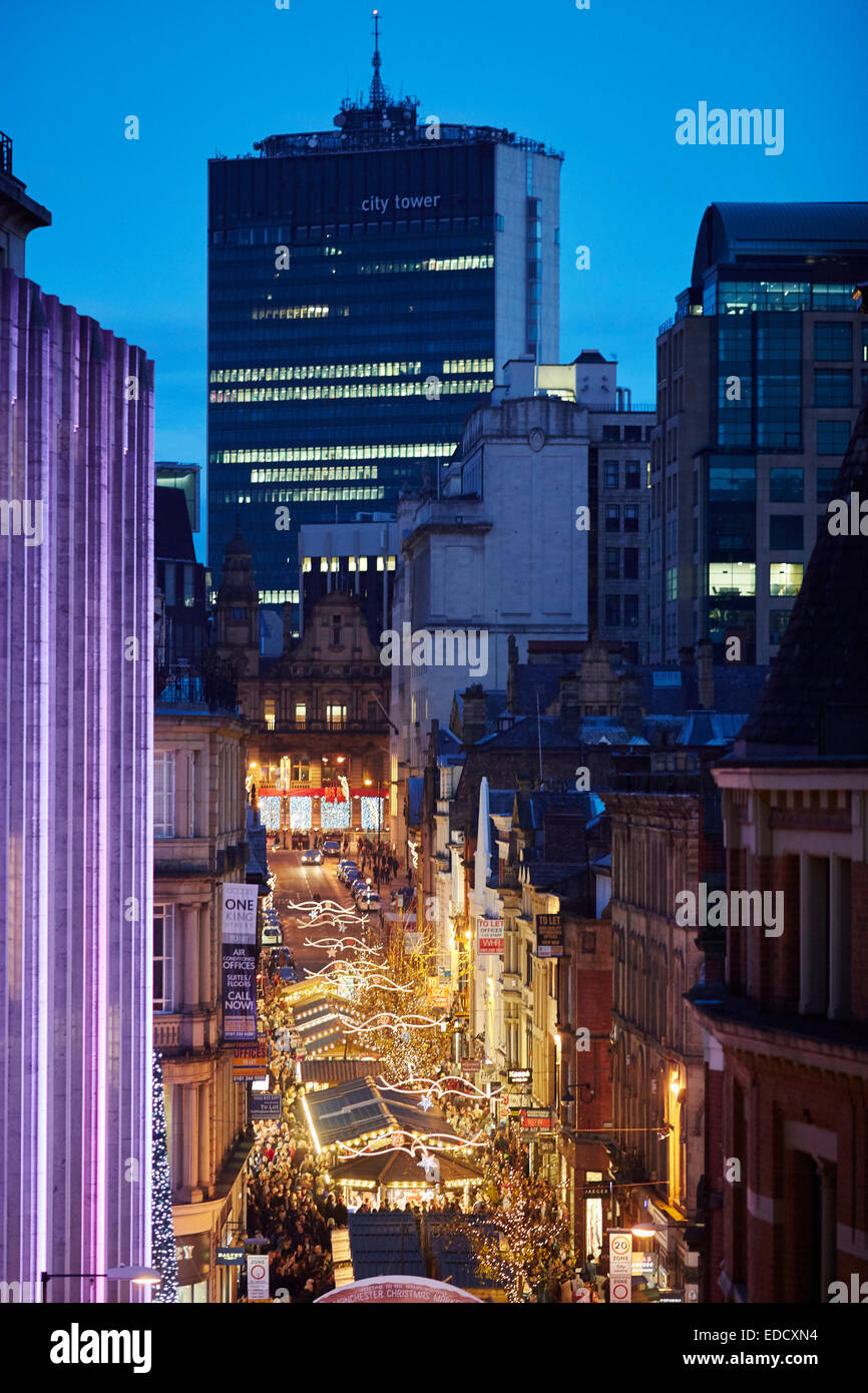 Manchester Christmas Markets and lights 2014, decorative festive lights over King Street and framed by City Tower Stock Photo