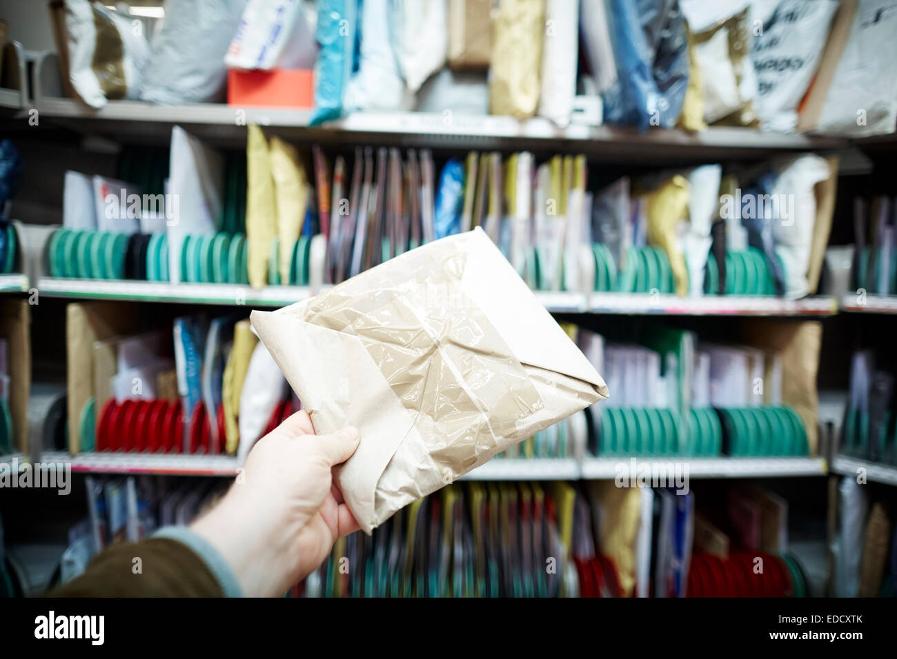 Royal Mail Manchester South delivery office workers sorting the mail by hand Stock Photo