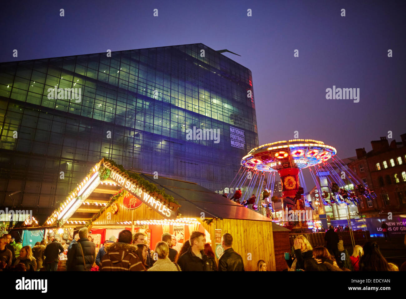 Manchester's German Christmas Markets, in the new location of Cathedral gardens  fairground ride Swing Ride Stock Photo