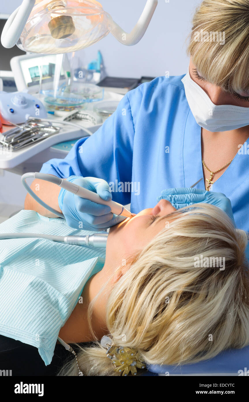 dentist with patient, expertise, drilling and curing Stock Photo Alamy