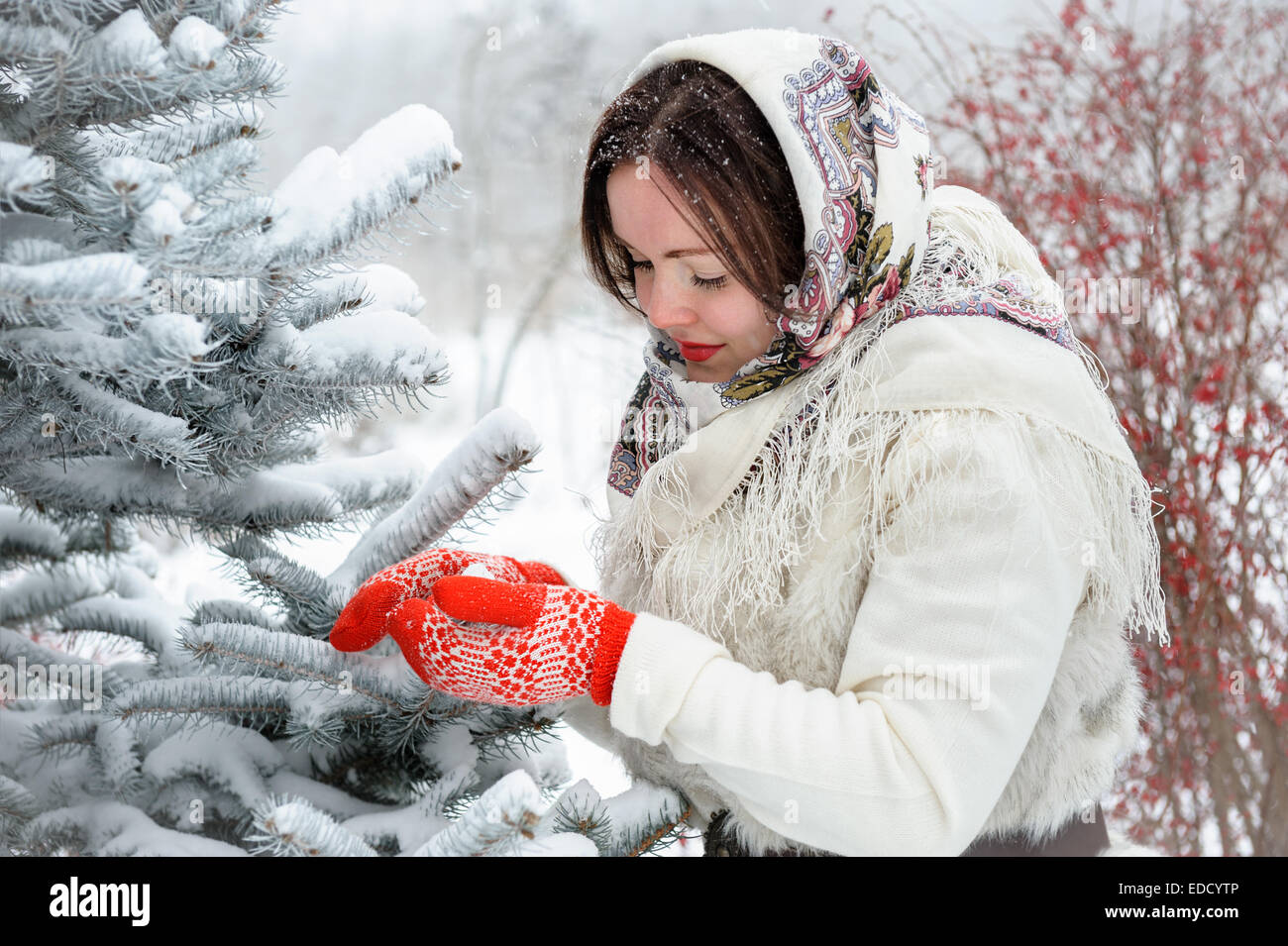 Young Russian woman in winter park Stock Photo