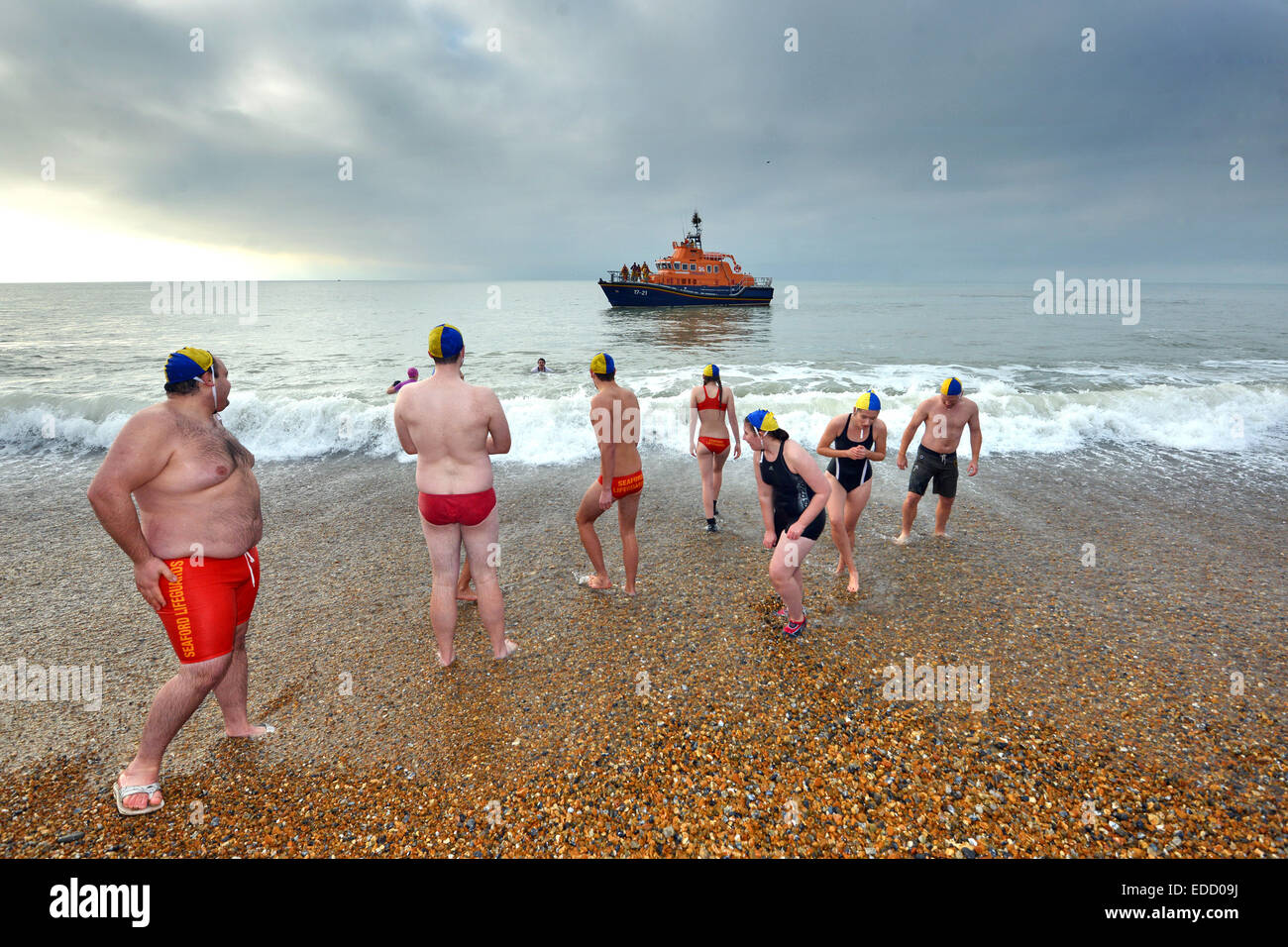 New Year dip in the sea by Seaford Lifeguards, Seaford Bay, Sussex, UK Stock Photo