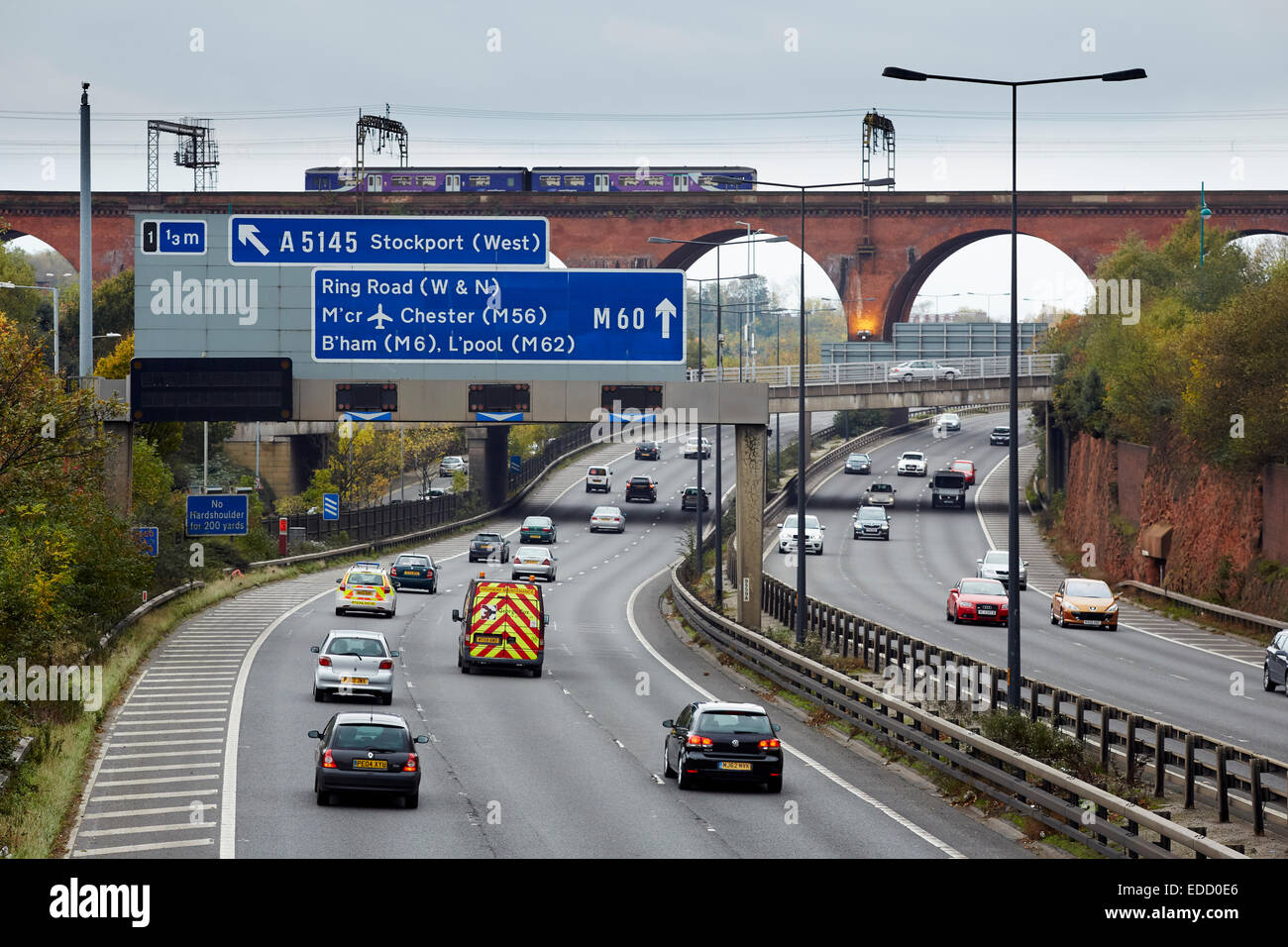 The M60 (was M63) motorway running through Stockport, with The railway viaduct in the distance Stock Photo