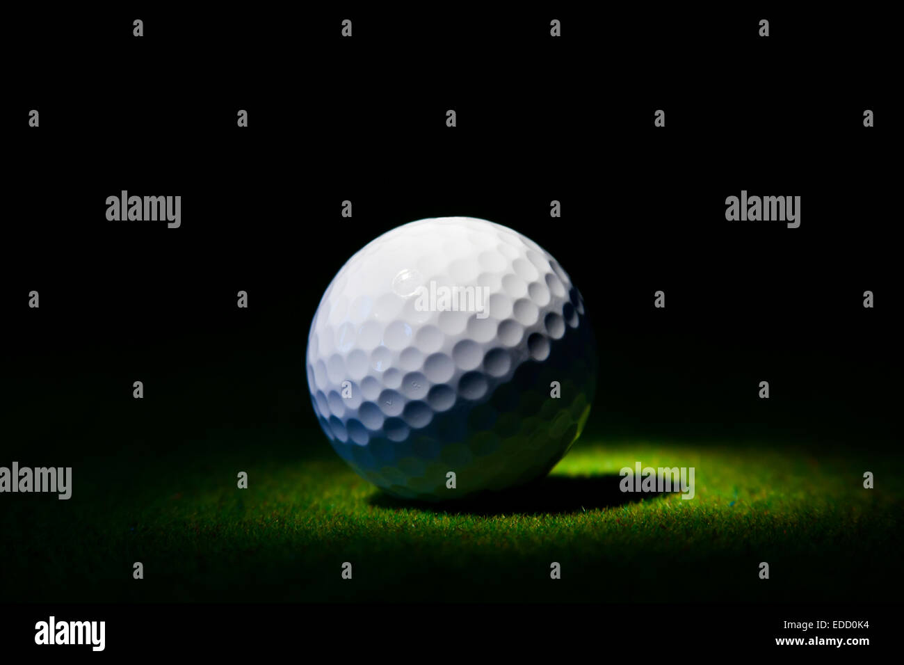 Golf ball under the spotlight Stock Photo