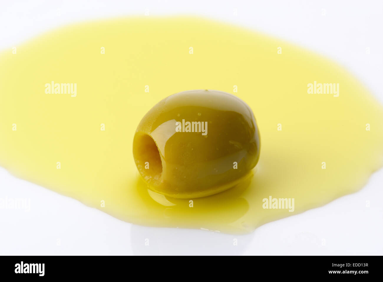 Pitted green olive in oil Stock Photo Alamy