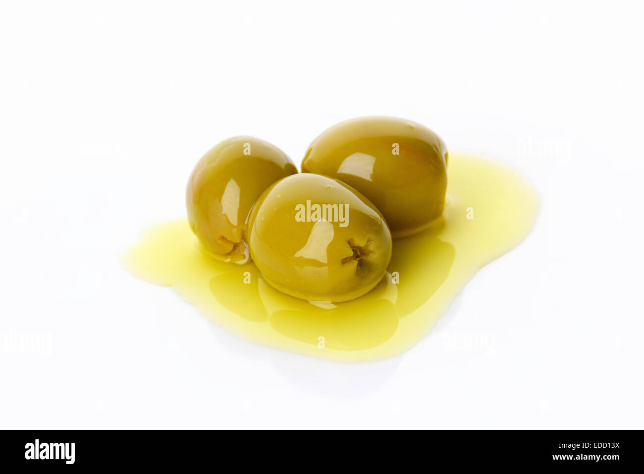 Pitted green olives in oil Stock Photo Alamy
