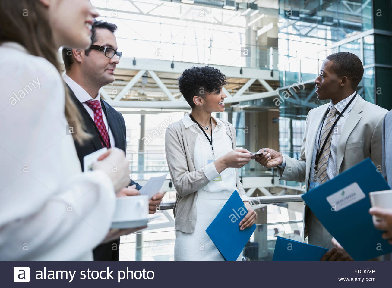 Business people networking at conference Stock Photo