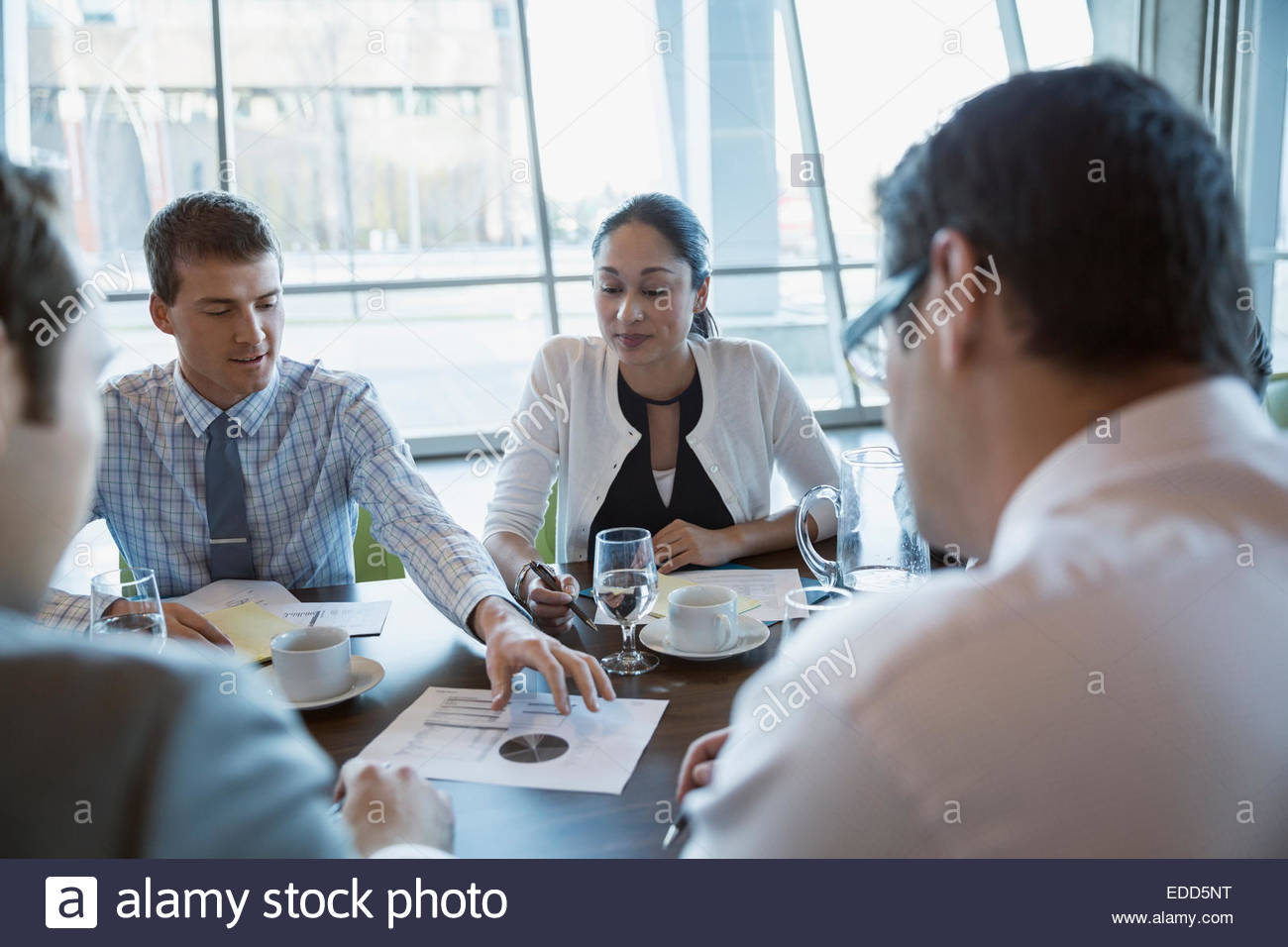 Business people discussing data in conference room meeting Stock Photo