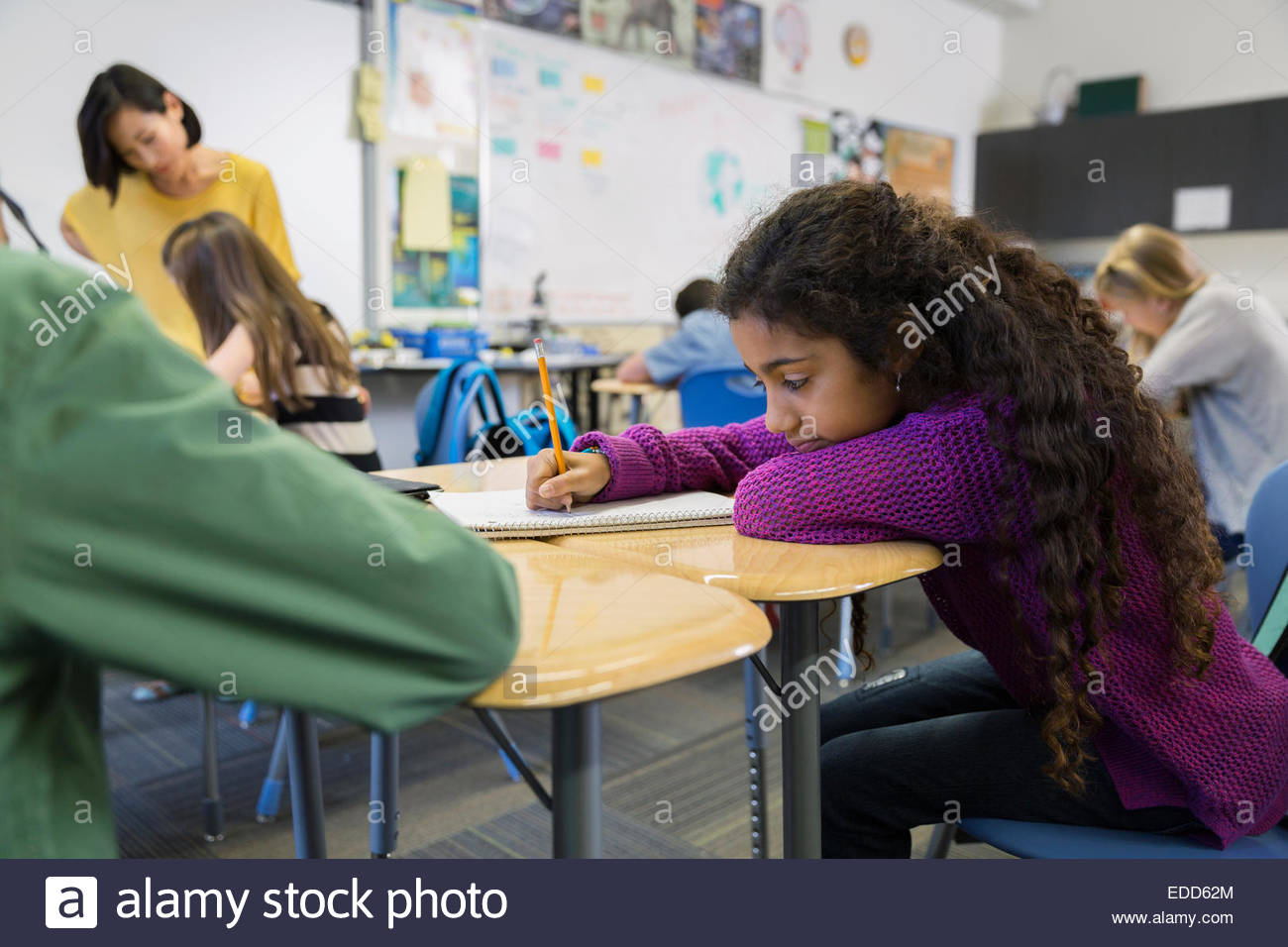 Elementary students at desks in classroom Stock Photo Alamy