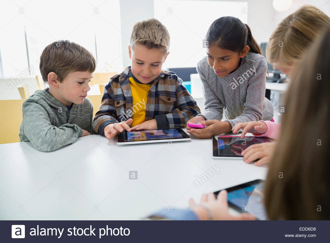 Elementary students using digital tablets in classroom Stock Photo Alamy
