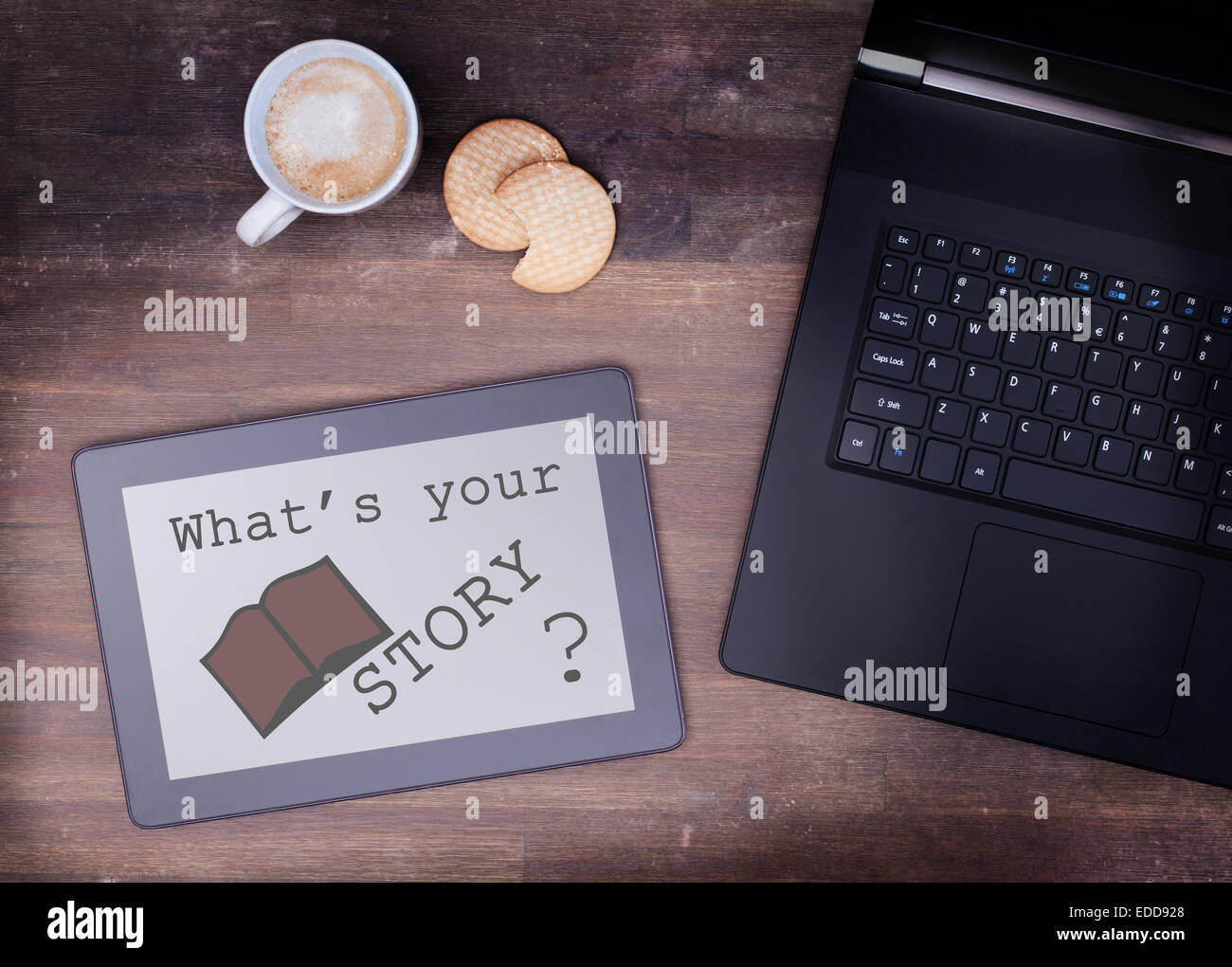 Tablet touch computer gadget on wooden table, what's your story, vintage look Stock Photo